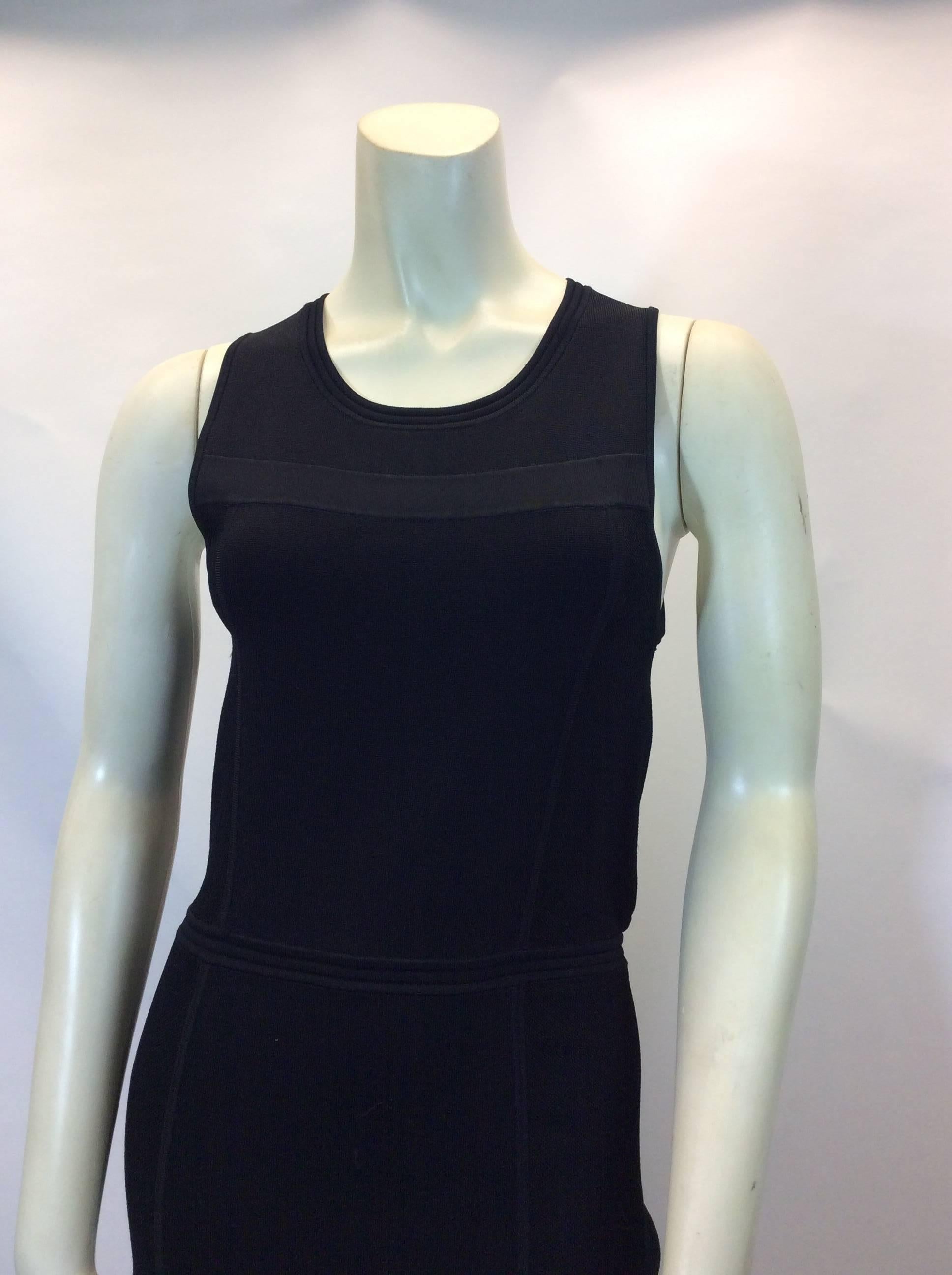ALC Black Knit Open Back Dress 
Snap buttons in the back with two cut outs
Sleeveless style
$199
Made in China 
Size large 
Material has a fair amount of stretch to it! 
