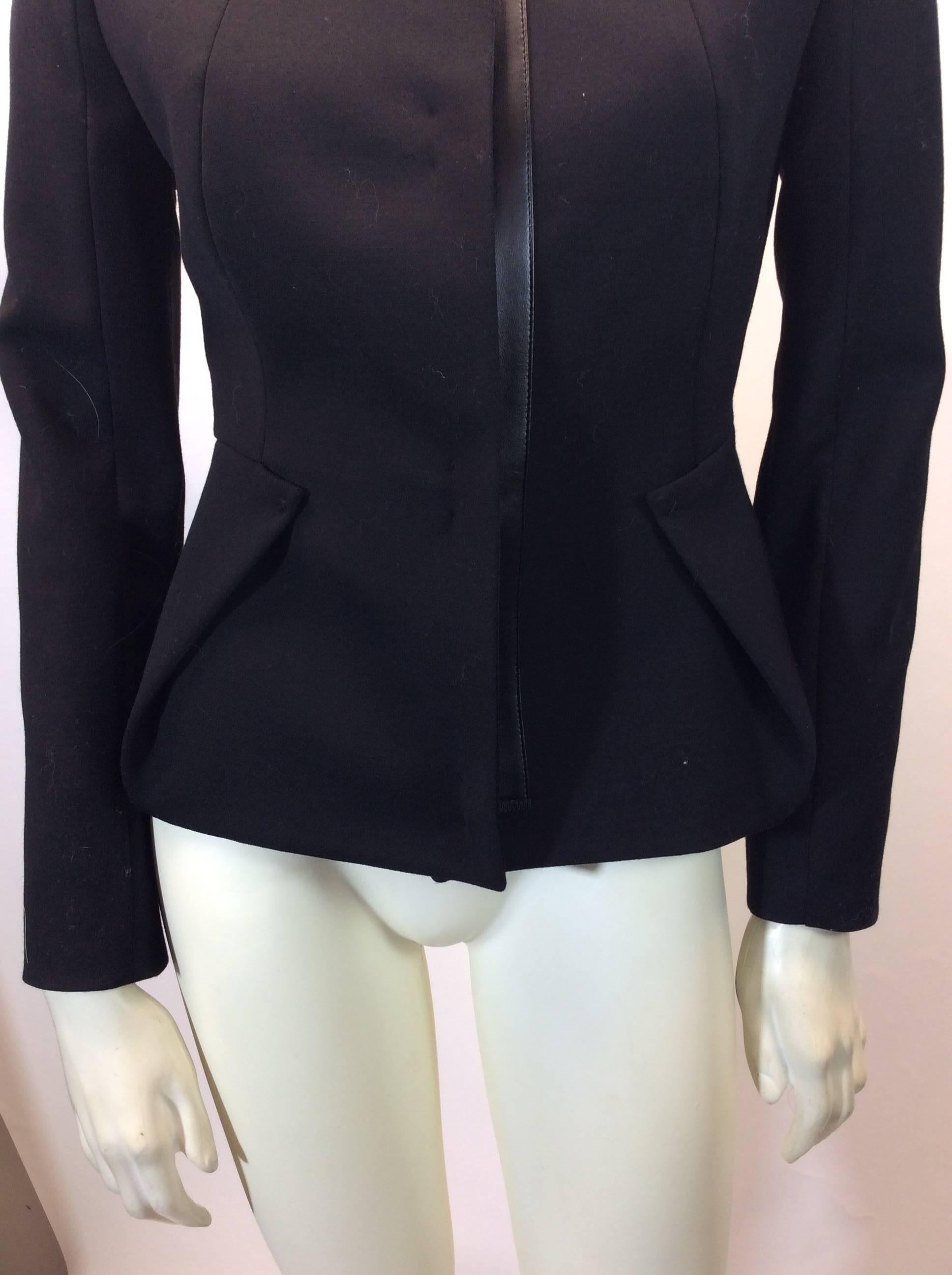 Pucci Black Leather Trim Blazer
Size 36
Center clasp closures with leather trim
Made in Italy
Fully lined interior
$250

