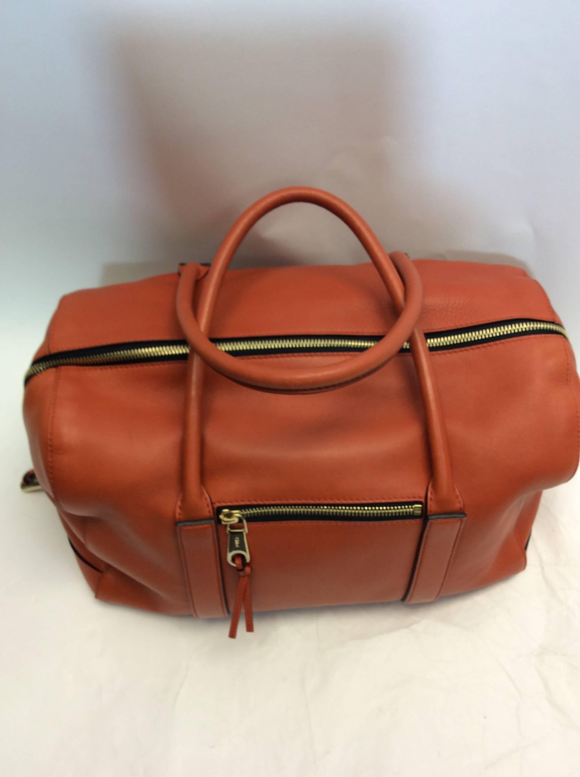 Chloe Orange Leather Speedy
Center zip closure
Top handles
$499
