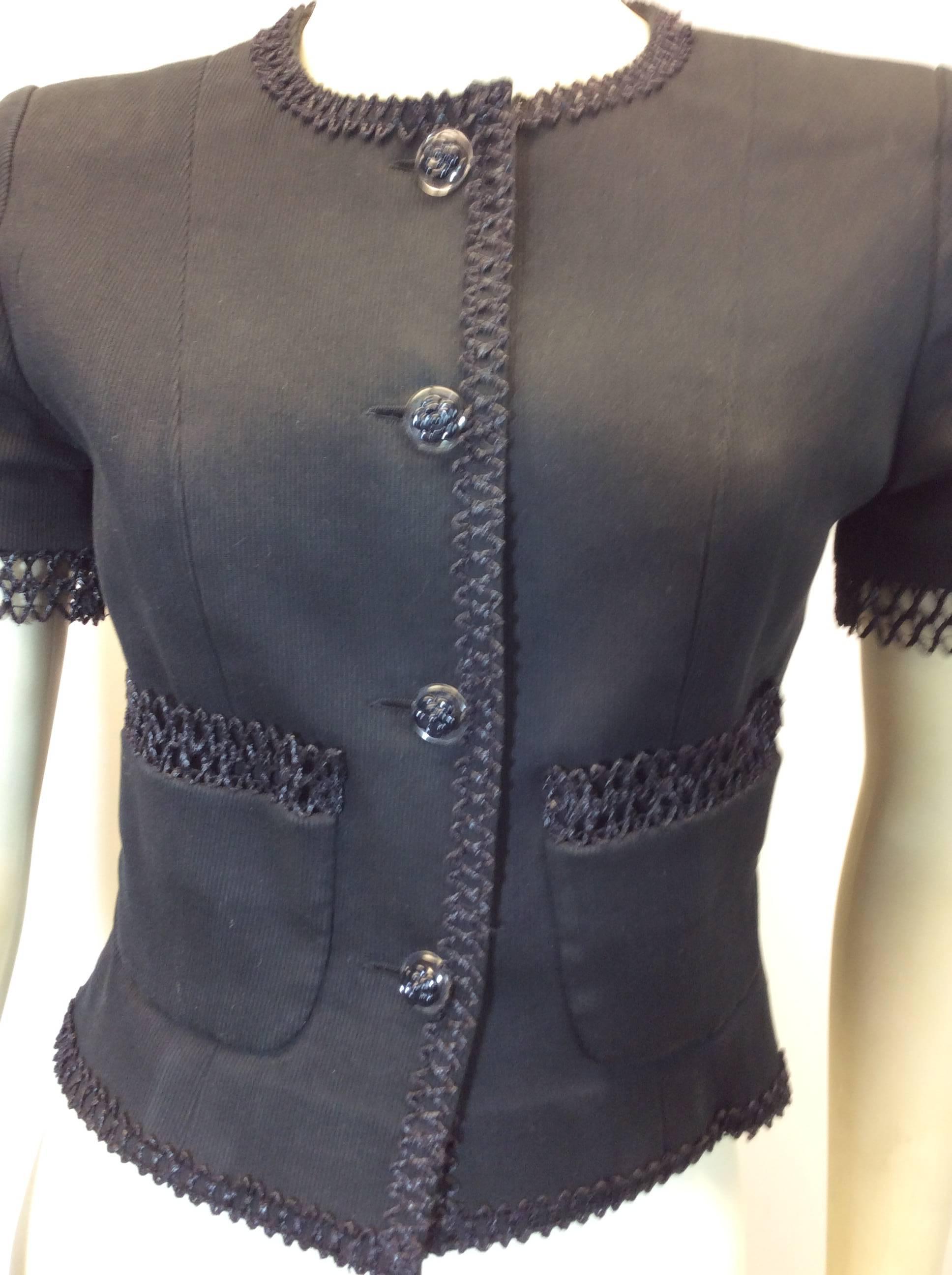 Chanel Black Short Sleeve Button Up Blazer
Size 36
$399
Cotton and Elastane
Trim detailing