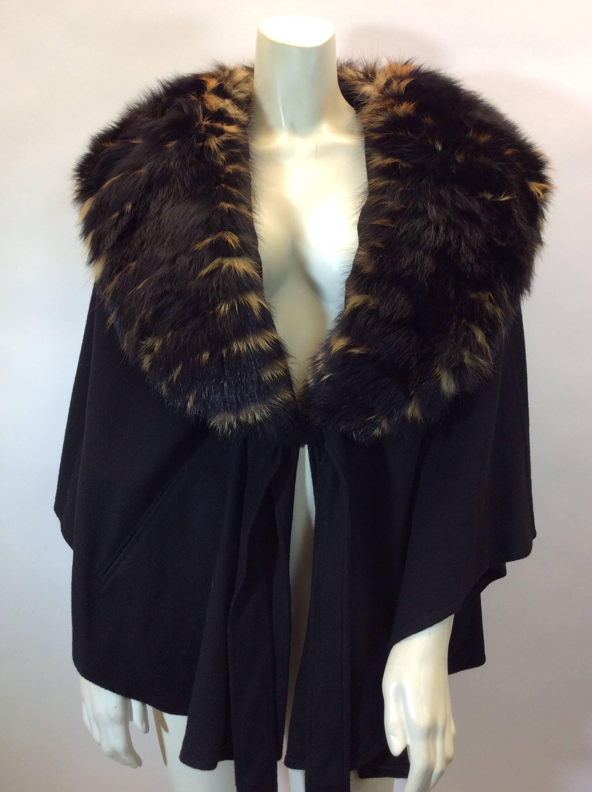Loro Piana Cashmere Cape With Fox Collar
$4,000
26 inches long on the side
Tie belt closure
Made in Italy