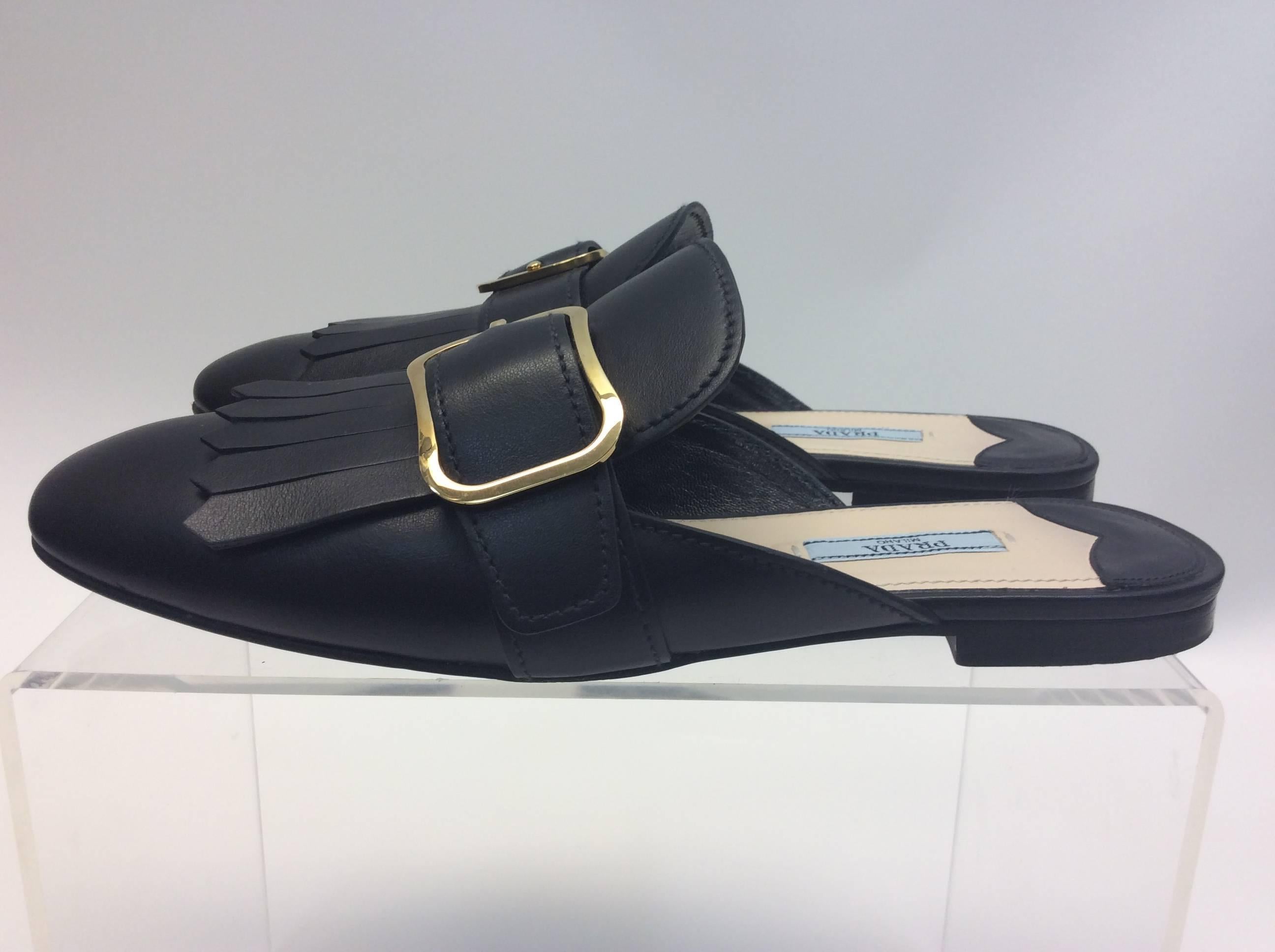 Prada Black Leather Fringe Slide with Buckle
$450
Made in Italy
Leather
Size 39
