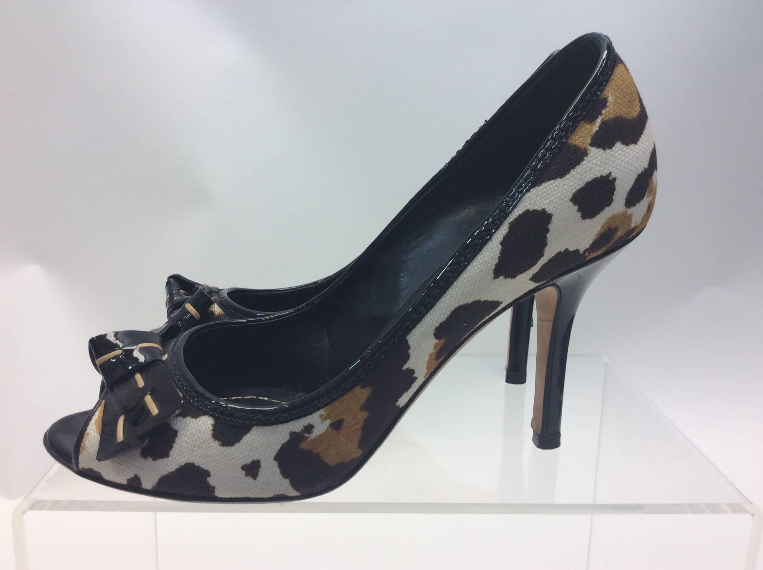 Christian Dior Animal Print Peep Toe Pump with Bow
$165
Made in Italy
Size 38
3