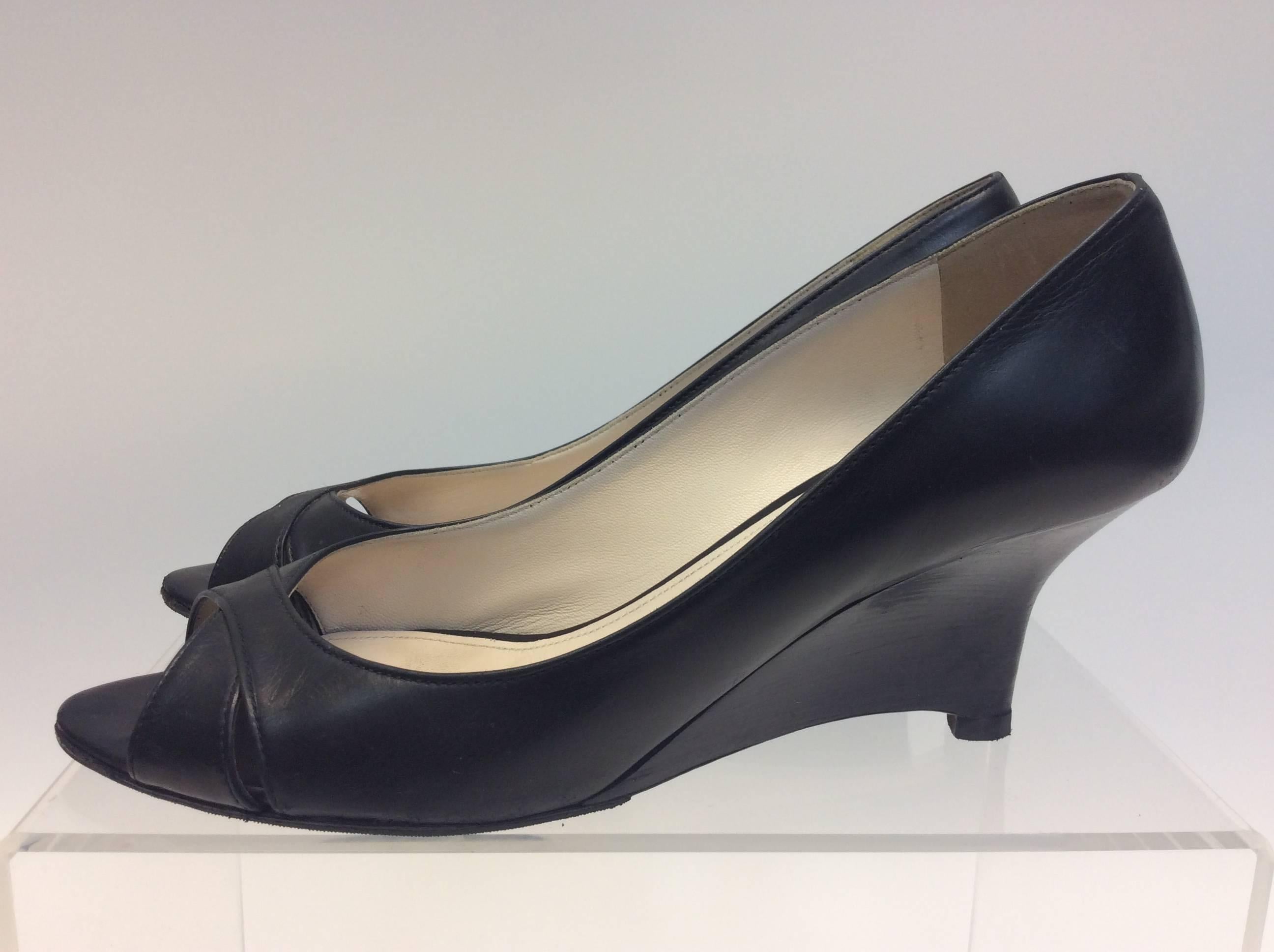 Prada Black Leather Peep Toe Wedge
$250
Made in Italy
Leather
Size 39
2.5” heel
