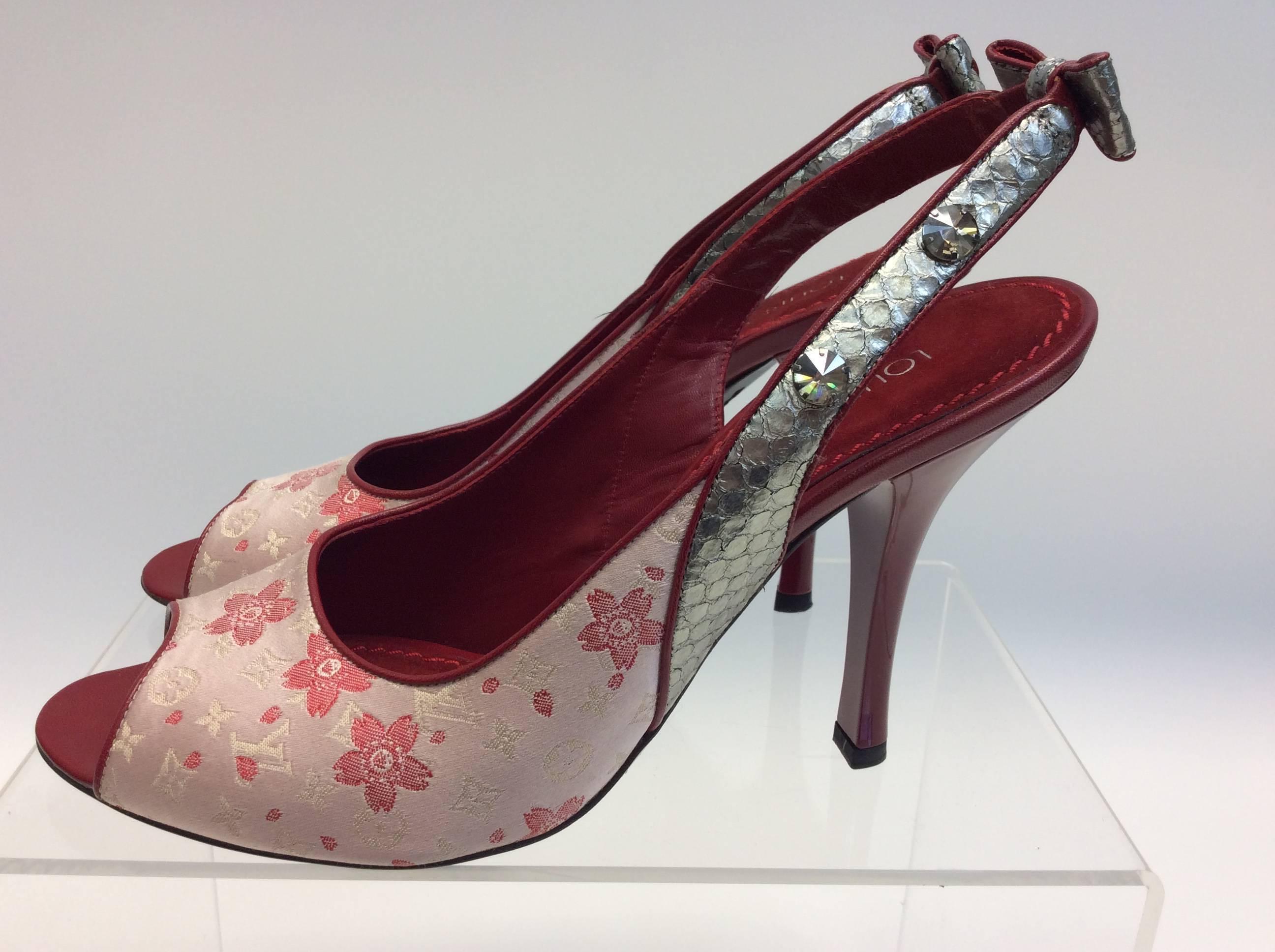 Louis Vuitton Red and Pink Floral Peep Toe Heel
Sling Back
Bow detail
Leather and Peau de Soie
$399
Made in Italy
Size 40
4” heel