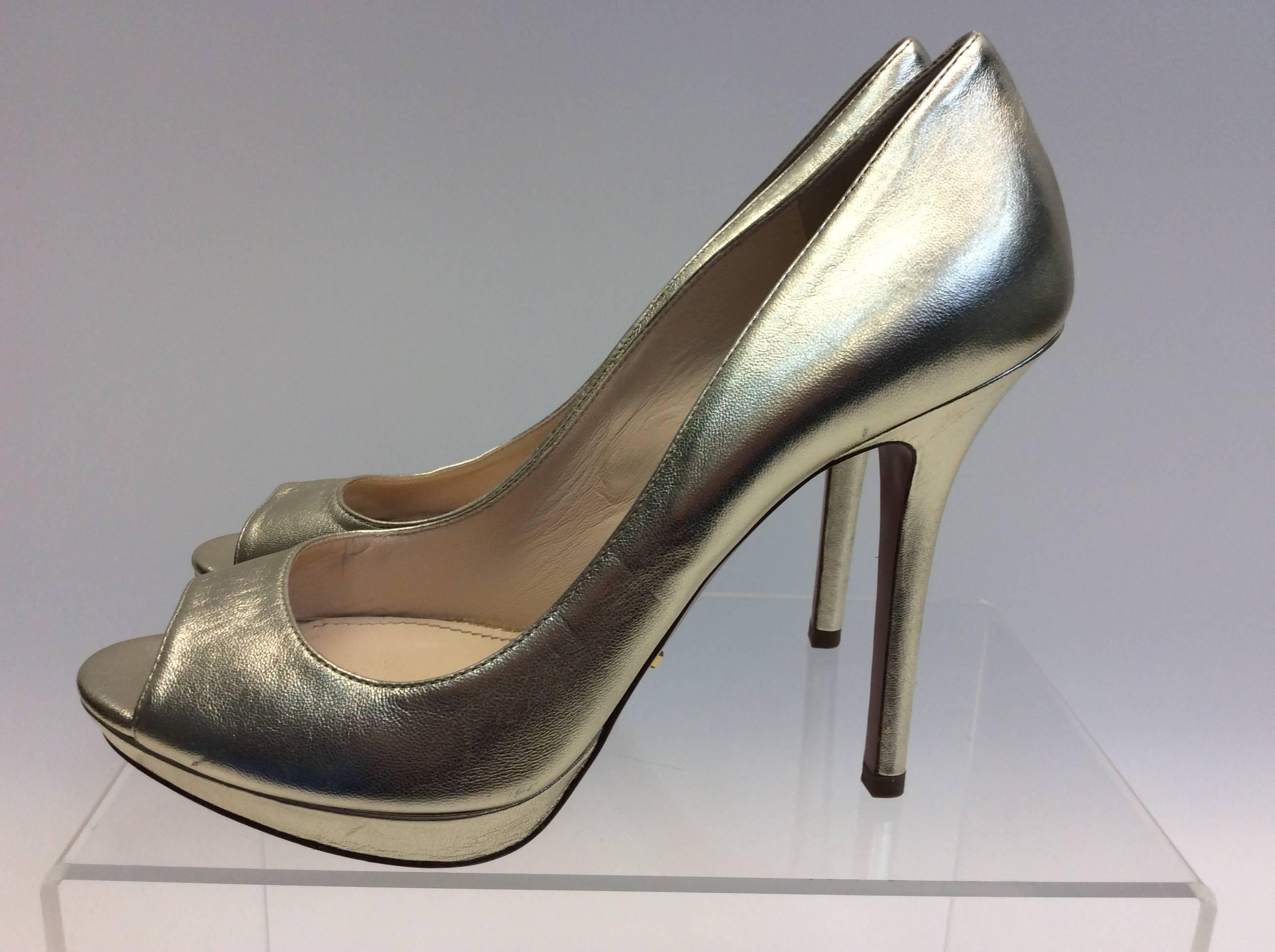 Prada Gold Leather Peep Toe Pump
$299
Made in Italy
Size 38.5
4.75