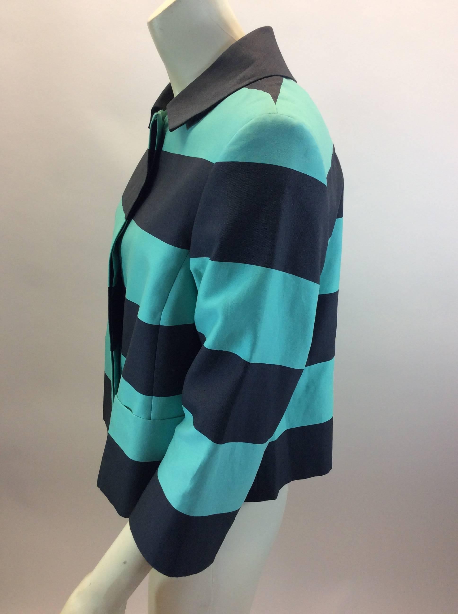 Akris Turquoise Striped Cropped Jacket
$225
Made in Romania
84% Cotton, 16% Silk
Size 8
Length 20