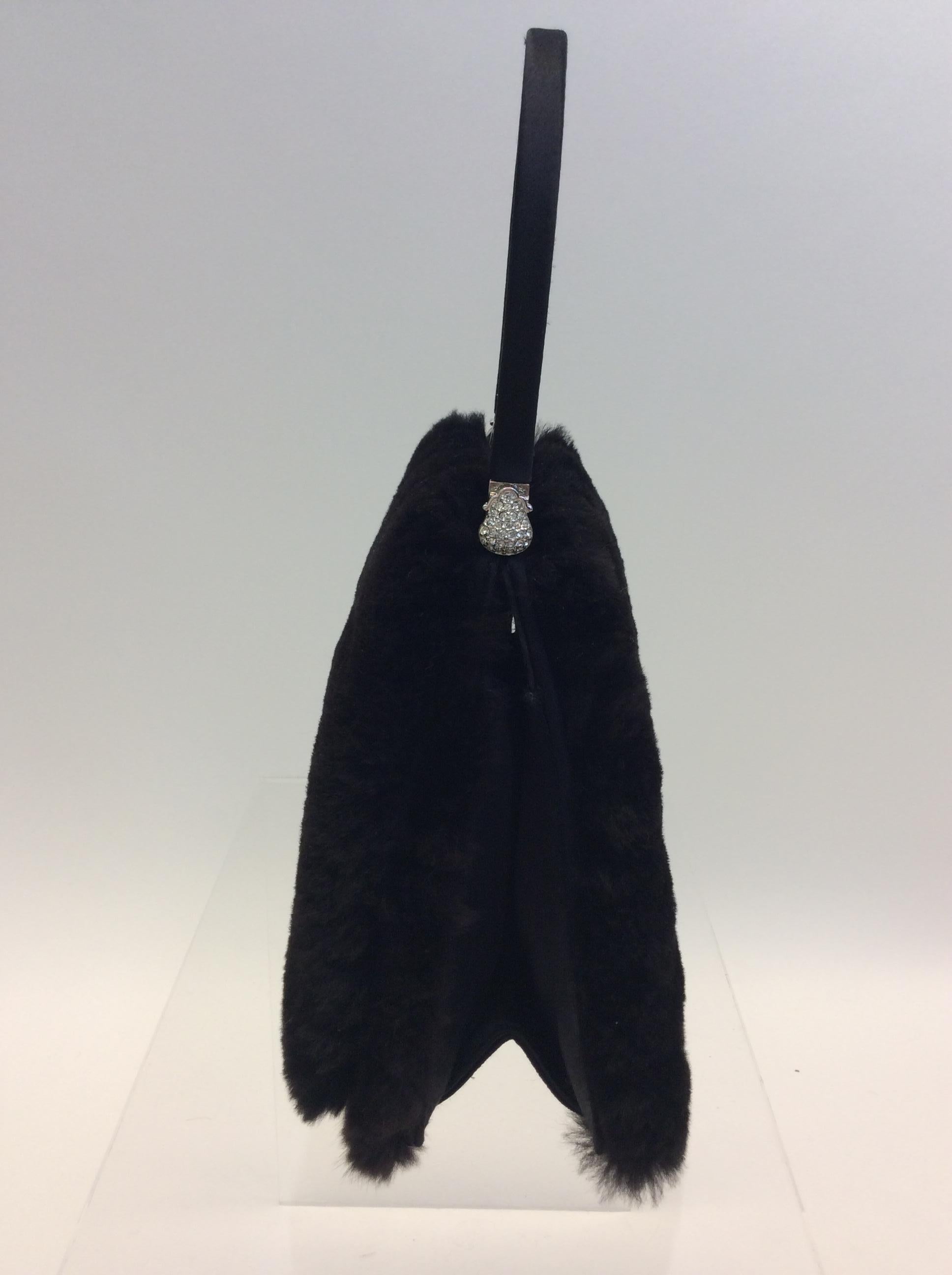Judith Leiber Black Mink Handbag
$599
Rhinestone embellishment
5.5