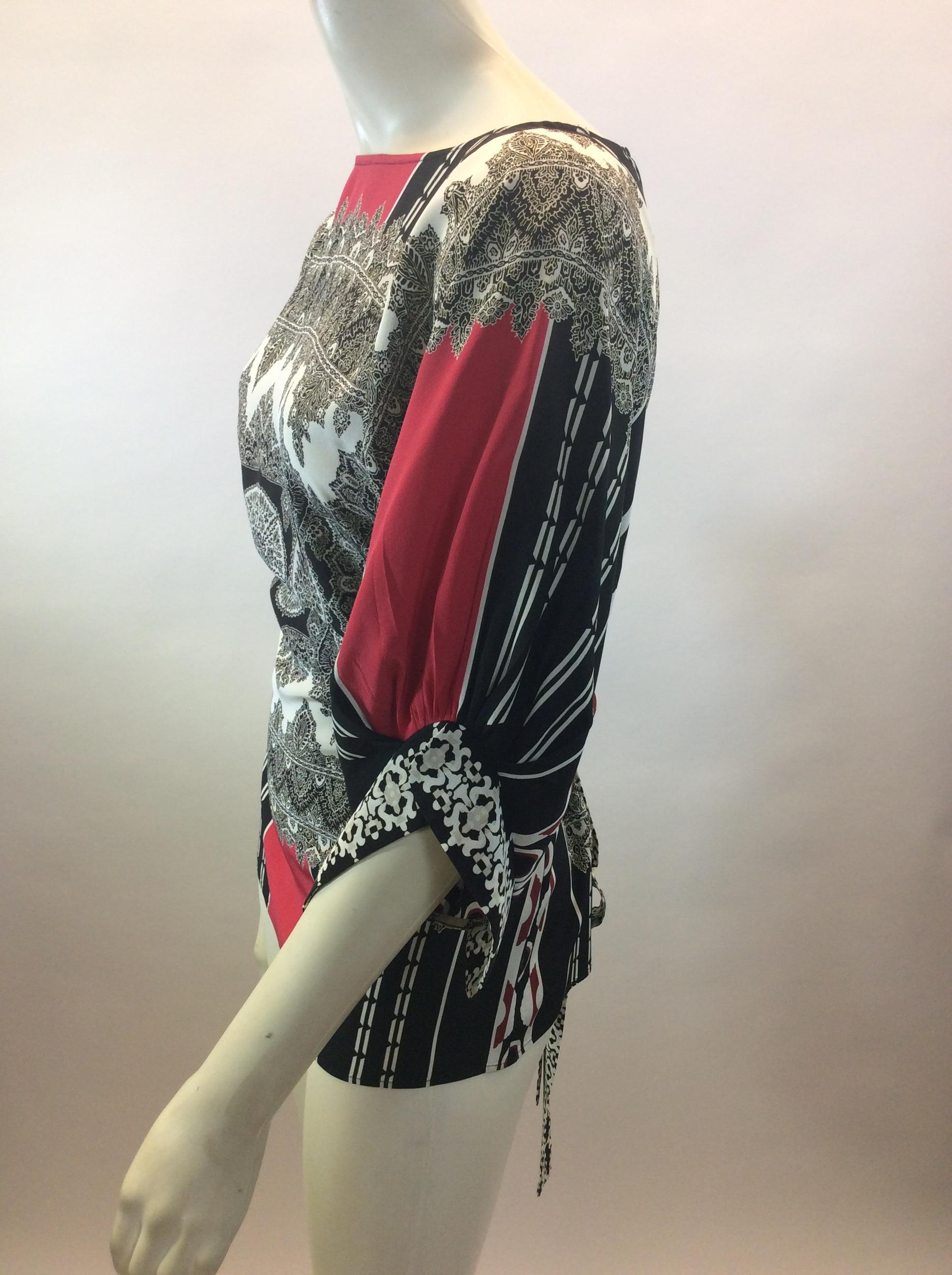 Etro Black, White, and Red Print Silk Blouse
$199
Made in Italy
100% Silk
Size 38
Length 25