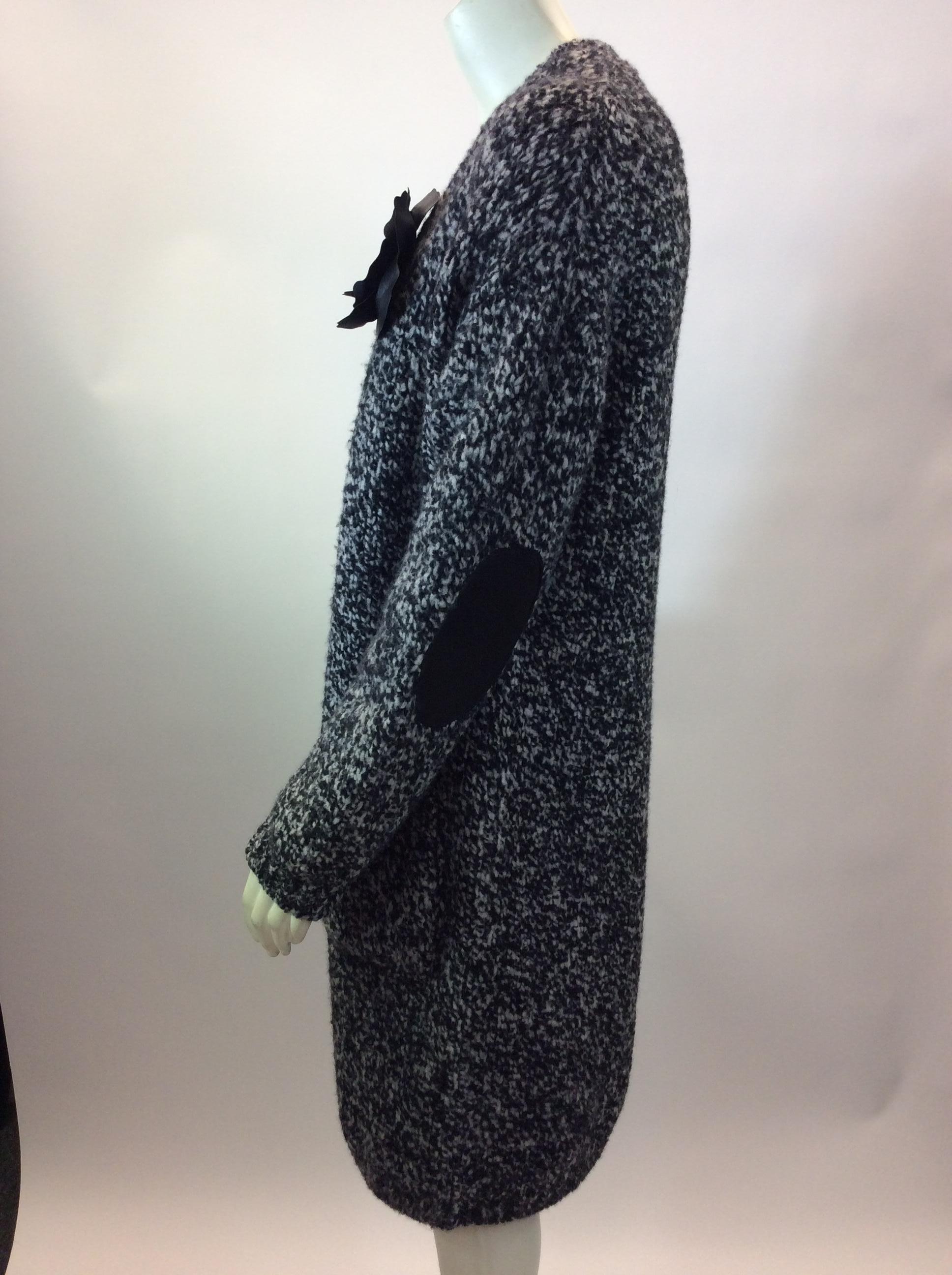 Twin Set Black and White Cardigan with Flower
$199
Made in Italy
85% wool, 13% nylon, 2% elastane
Size small
Length 39