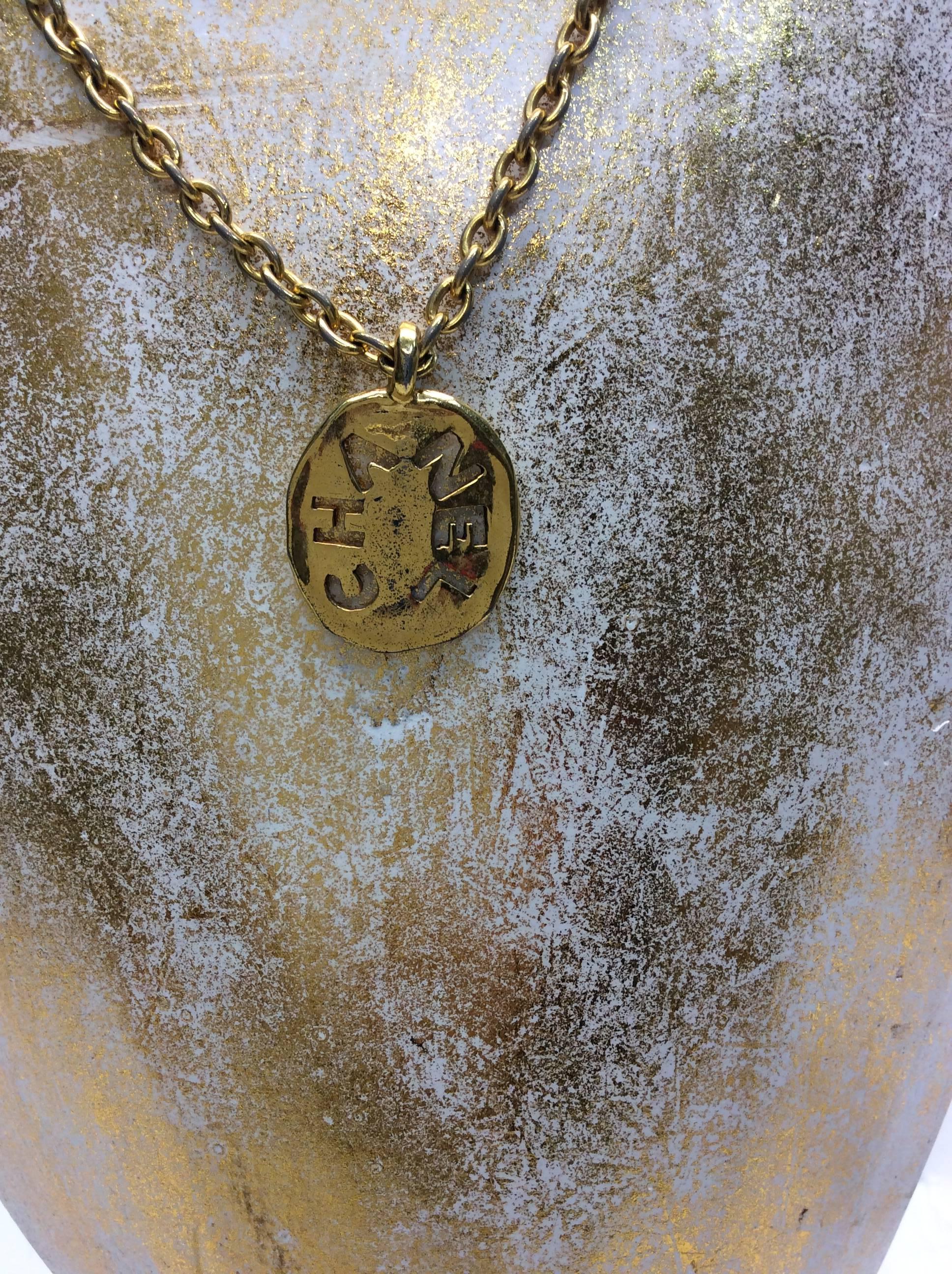 Chanel Gold Coin Pendant Necklace
$499
Made in France
Back clasp closure
15 inch strap drop

