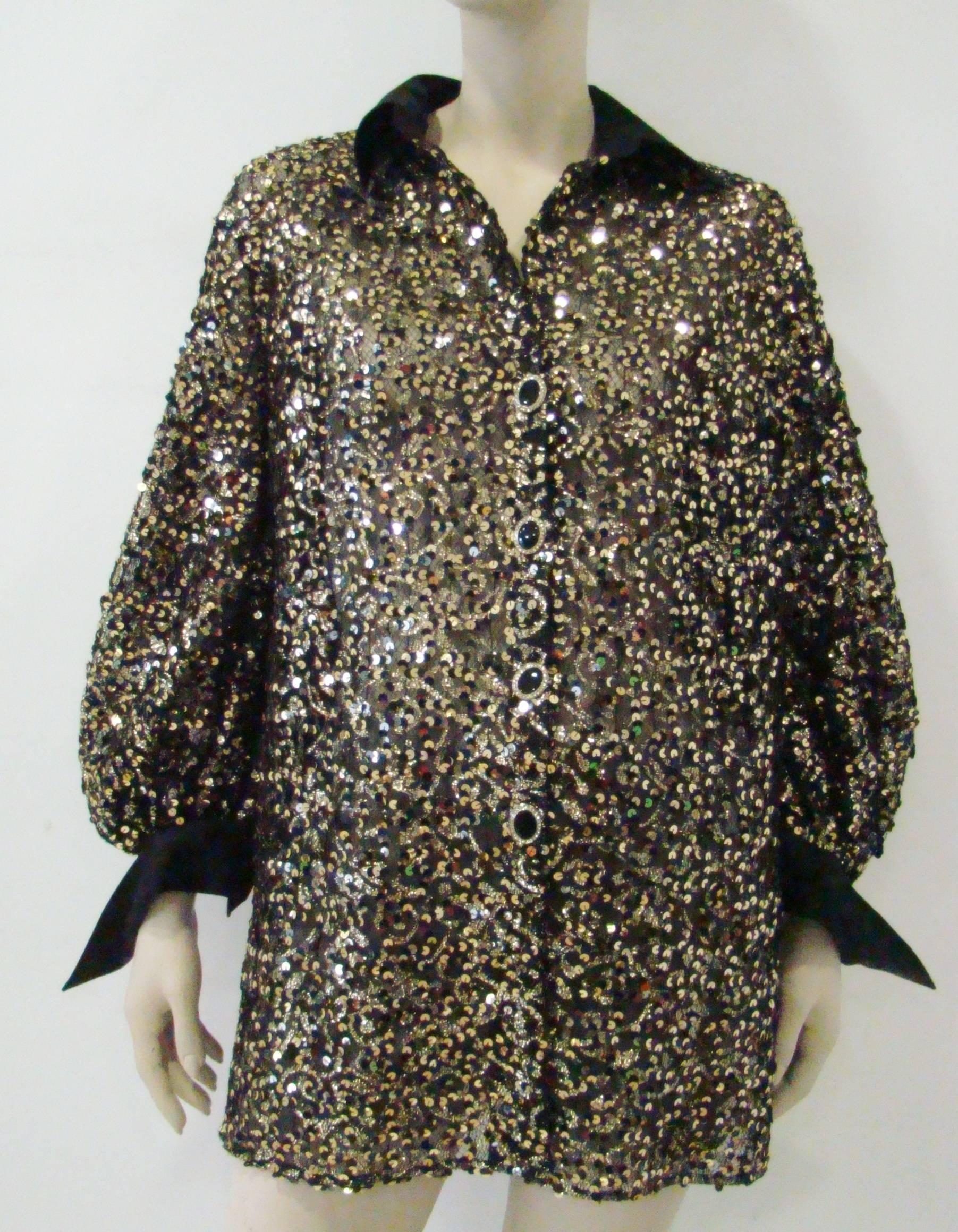 Flaunt In This Metallic Gianfranco Ferre Evening Jacket. Made From Gold Metallic Sequins Featuring A Black Collar Combined With Long Cuffed Sleeves. Front Button Fastening And Fully Lined Inside With Black Net. Wear It And Feel Wonderful