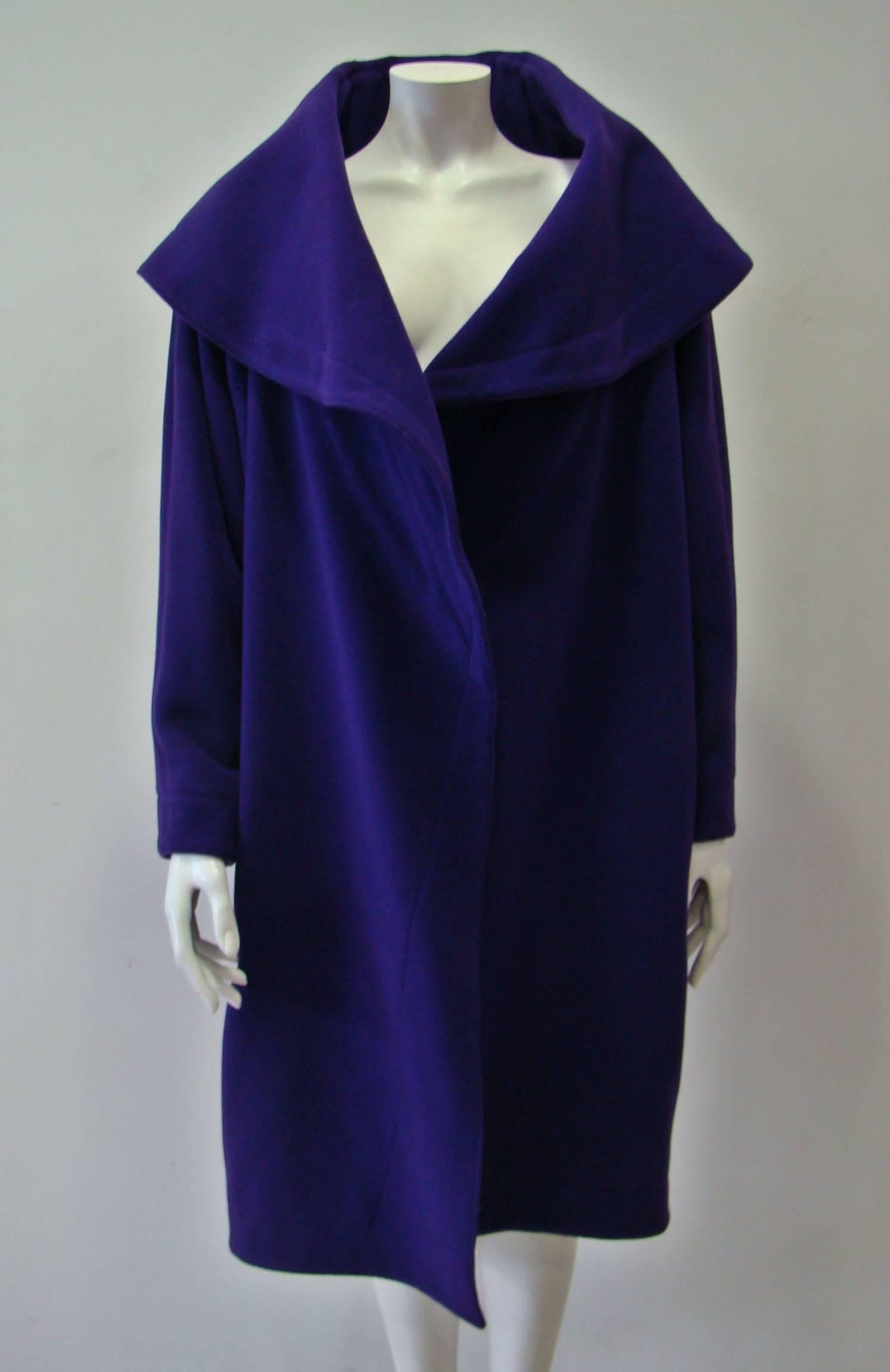 Add This Coat Into Your Everyday Wardrobe This Season As A Stylish Cover Up For Colder Days. A Spacious Purple Coat From Claude Montana With Wide Collar, Simple Long Sleeves And Roomy Patch Pockets. A Loose Style, Even If It Is Small It Can Easily