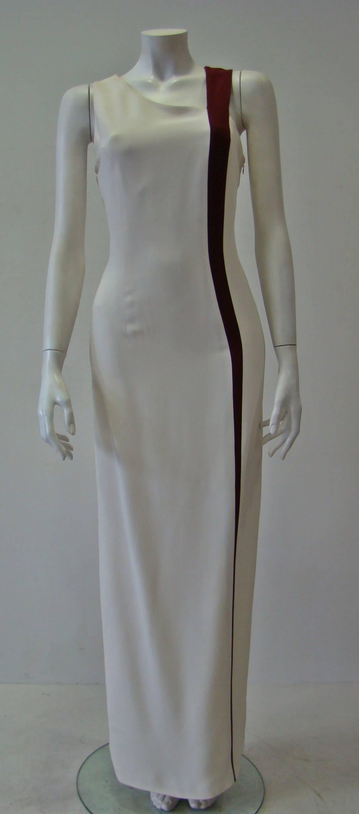 A Rare White Bodycon Evening Gown From Angelo Mozzillo Accented With A Burgundy Front And Back Side Seam For An Elongating Effect And A Back Seam Split For A Cool Silhouette. A Sleeveless Maxi Dress Featuring A Concealed Zip Fastening At Side And