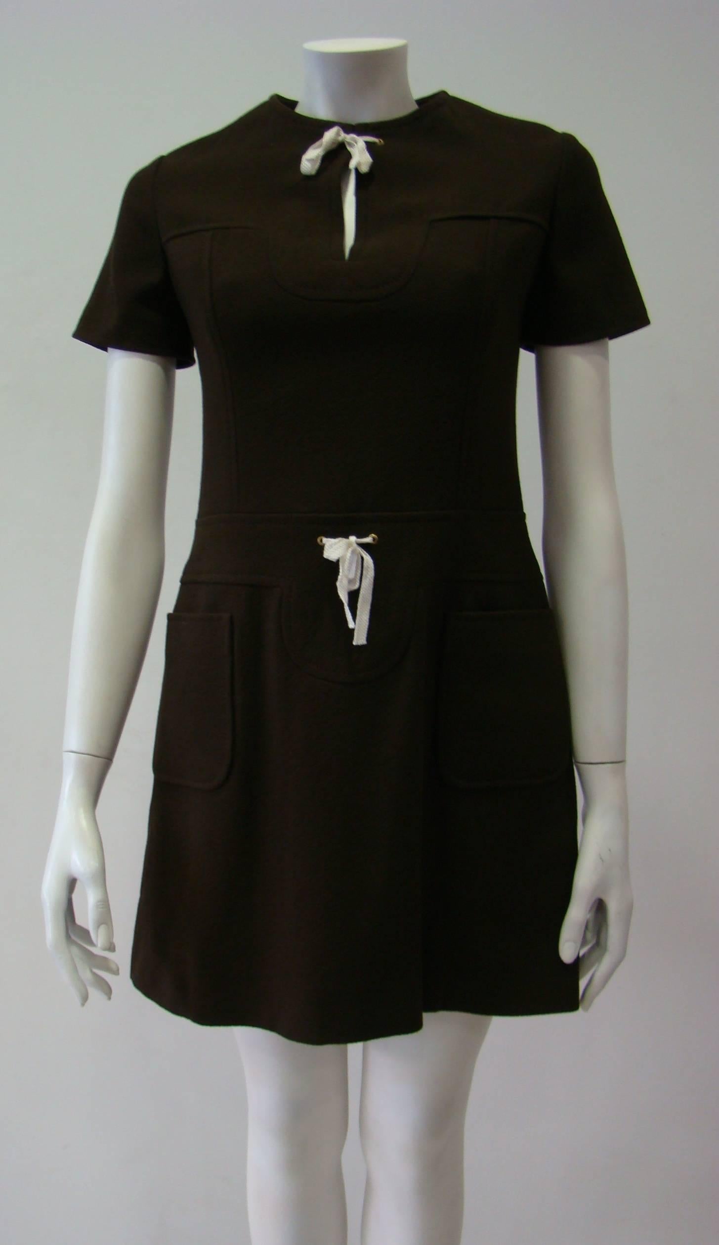 100% Wool Dress With A Simple Design Featuring Short Sleeves, A Stylish Lace Splice Neck And Waist, Two Small Front Pockets And A Back Zip Fastening. Unlined And Not Tight Mini Dress.