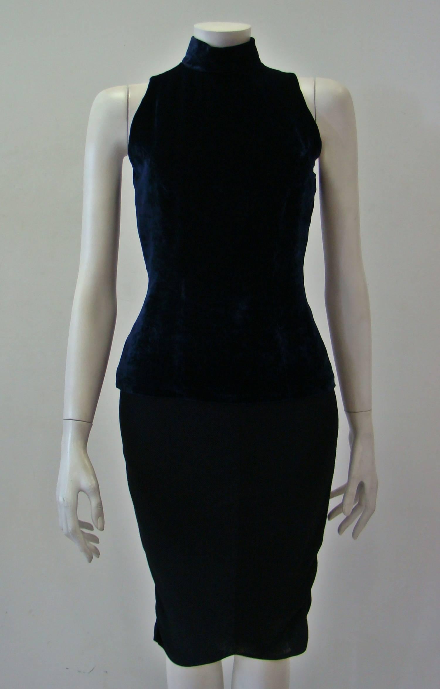 Angelo Mozzillo Navy Blue Velvet Bodycon Top Featuring A Polo Neck, No Sleeves And Back Zip Fastening.