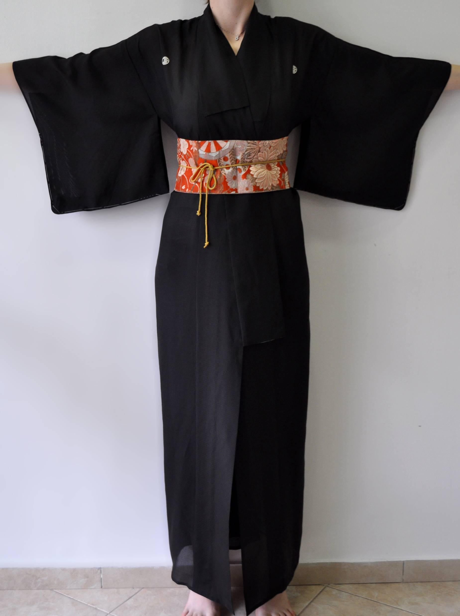 This is a vintage Japanese garment made from exquisite material wonderful artwork, hand made with meticulous workmanship; an item that was vastly expensive when first bought. A touch of the history and tradition of old japan; an item that is so