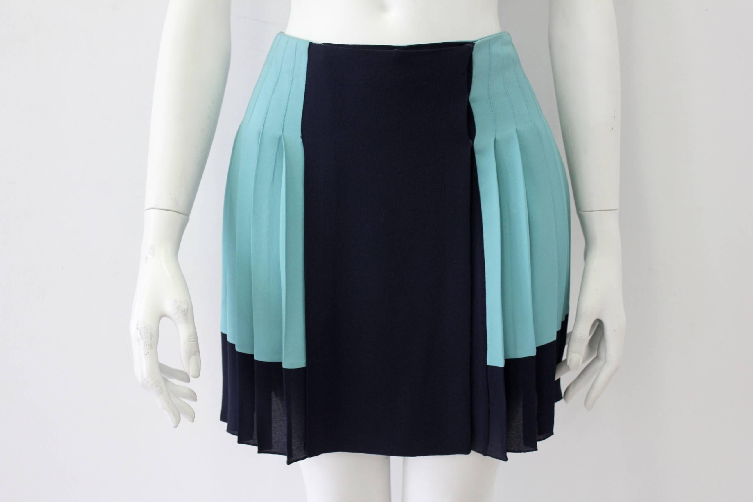 A Gianni Versace Couture Color-Block Mini Skirt Turquoise Color In Contrast With A Navy Blue Front. 100% Silk With Figure Flattering Pleates For Fluidity And Movement.