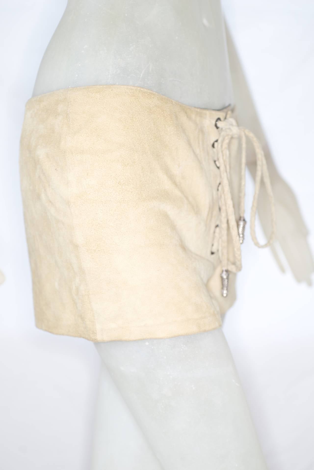 Beautifully crafted from supple suede these shorts from Los Angeles based Chrome Hearts capture this seasons Woodstock-inspired mood.  Shorts lace up the front and have silver toggles.