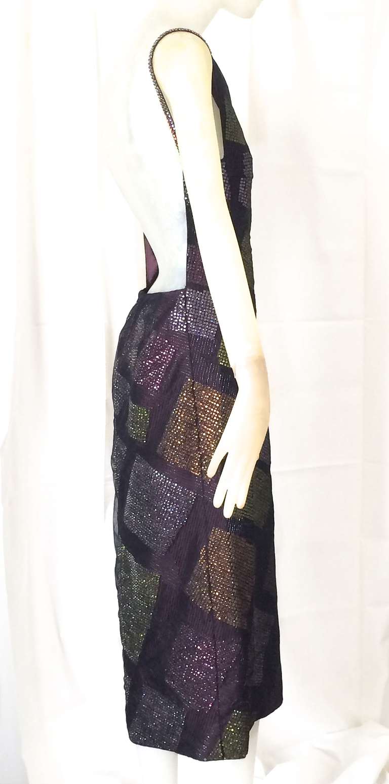 A beautiful Krizia dress, densely beaded in a graphic print dress.  Beading is lime and aubergine colored on an aubergine silk.  An unusual layer of tulle covers the beading.  Dress is deeply cut in the back so very backless.  For fit our mannequin