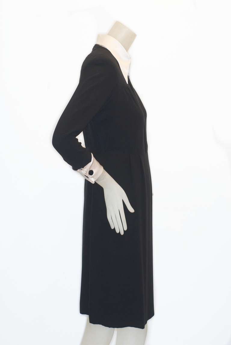 This simple and elegant Valentino haute couture dress from the 1970s is a lesson in Belle de Jour chic.  The lightweight black crepe dress is lined in black silk and the hem is weighted (Queen Elizabeth would rest easy knowing that if Kate Middleton