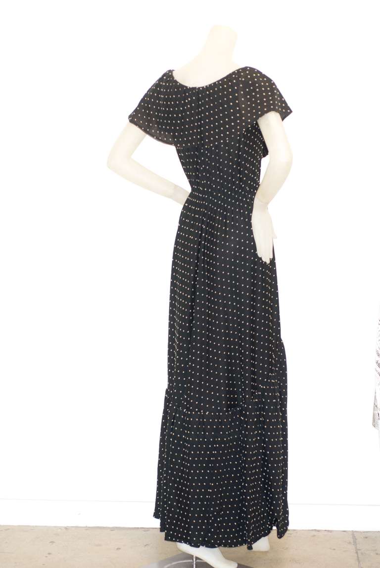 In the 1970s Halston was the man every woman wanted in her closet.  His designs were modern, fresh, sexy and comfortable.  This dotted Swiss wrap dress with a flirty ruffle is easy and looks like it enjoys a good party with lots of champagne and lip