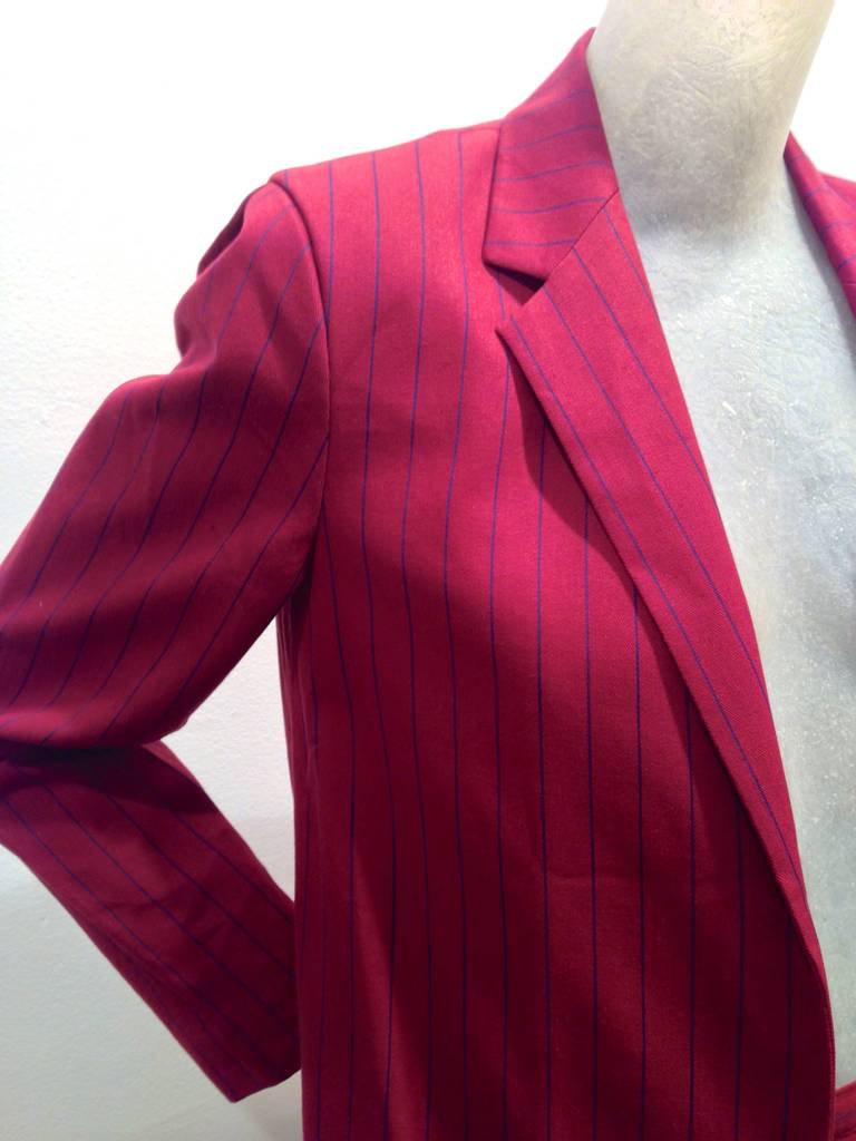 Mid 1980s Perry Ellis pin striped jacket in a crisp bordeaux colored cotton with trouser shorts.  Jacket is elongated and is worn soft like a cardigan with no closure.

Perry Ellis' work and career was recently celebrated in the book Perry Ellis: