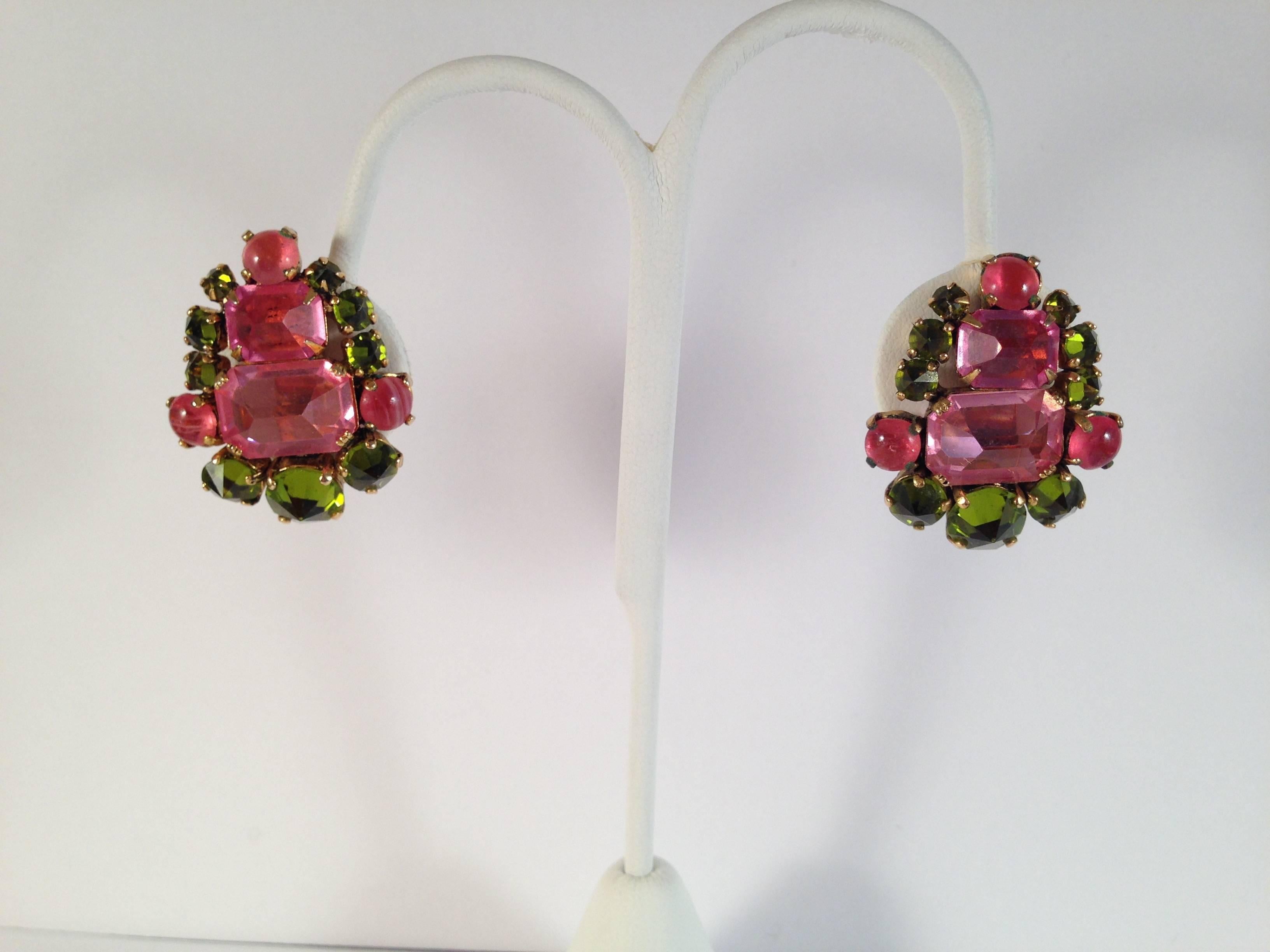 Beautiful richly colored 1960s pink and green clip on earrings by Schreiner New York. These are unsigned but have all the hallmarks of a Schreiner piece - the glass stones are set in the reverse with the pointy side set up instead of down and the