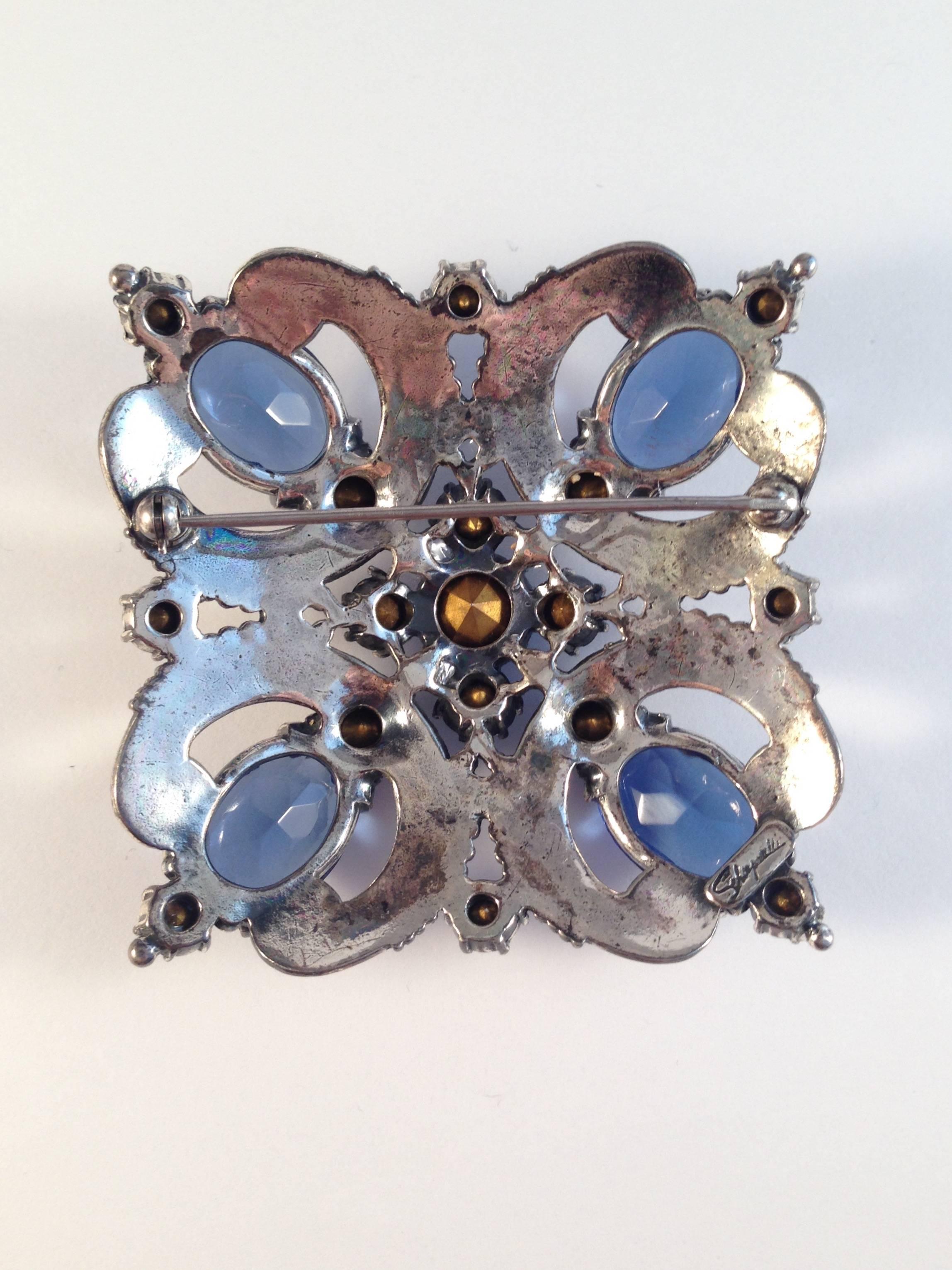 Schiaparelli Brooch and Earrings 1940s Silvertone and Blue Stones  In Excellent Condition For Sale In Chicago, IL