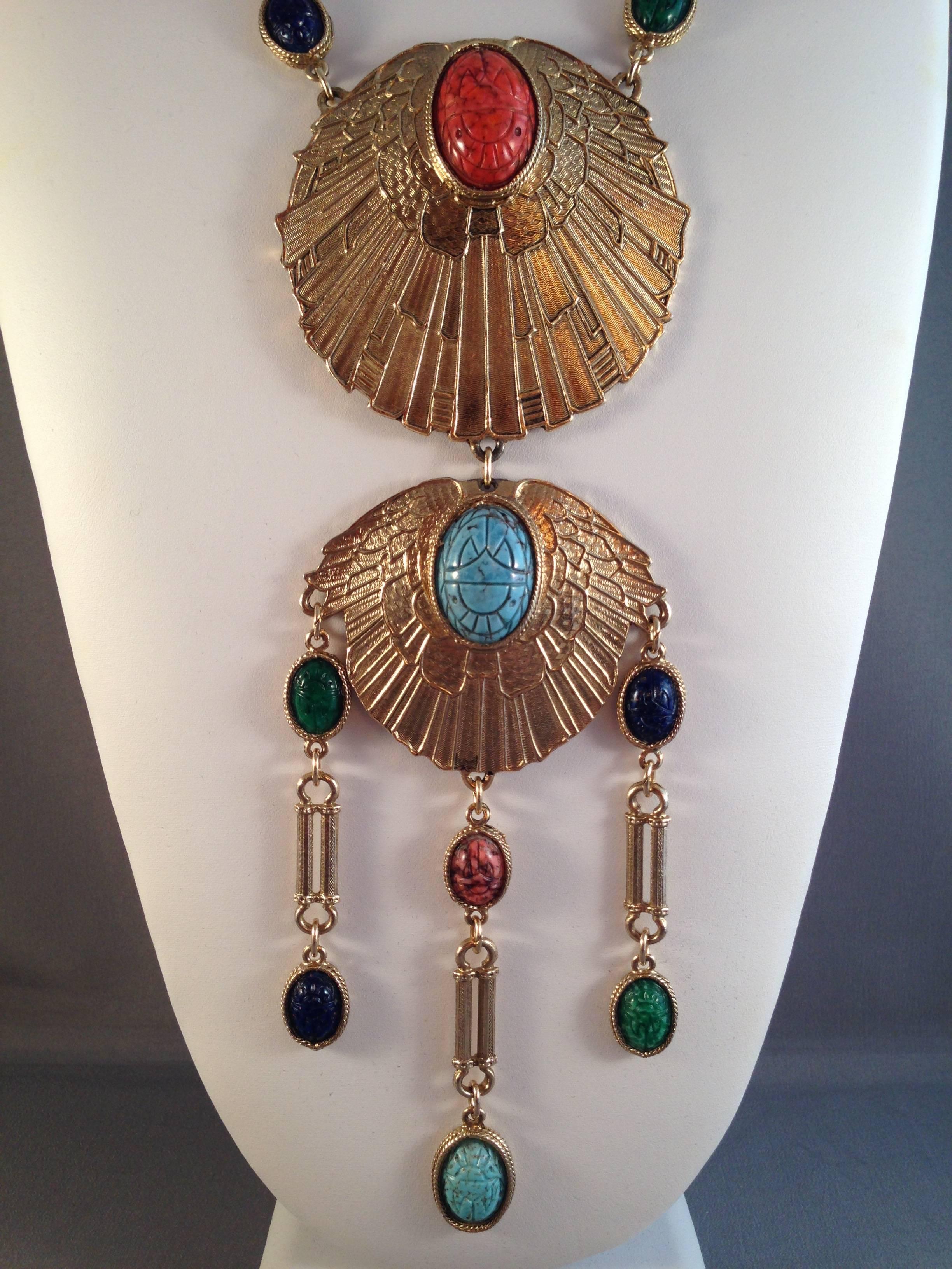 This is an incredible, huge 1970s statement piece from Accessocraft. It is made in the Egyptian revival style. It is gold-tone and has an incredible 8 1/2