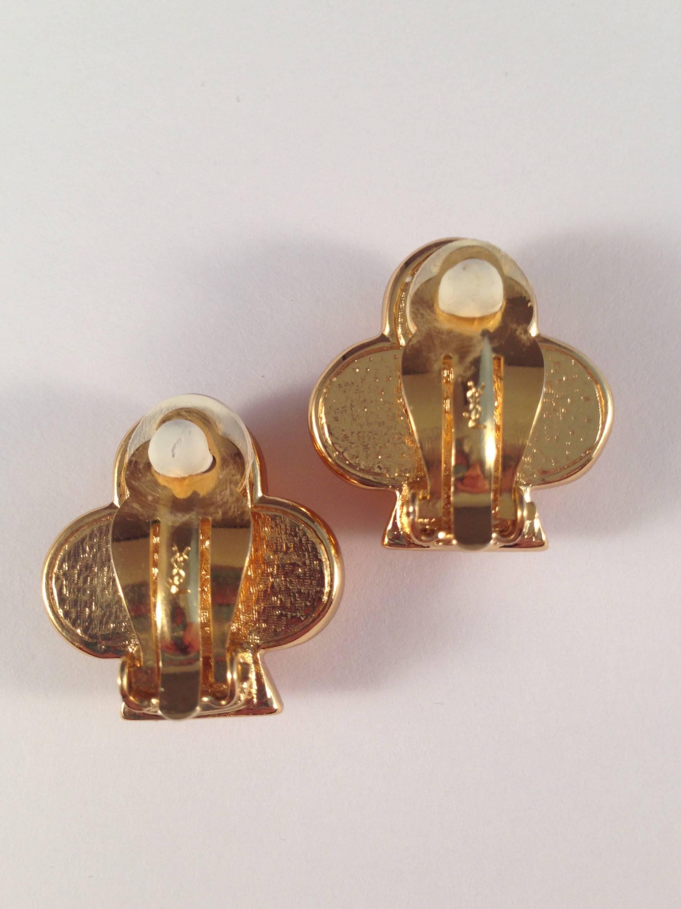 These Yves Saint Laurent clip-on earrings are from the 1980s and measure  7/8