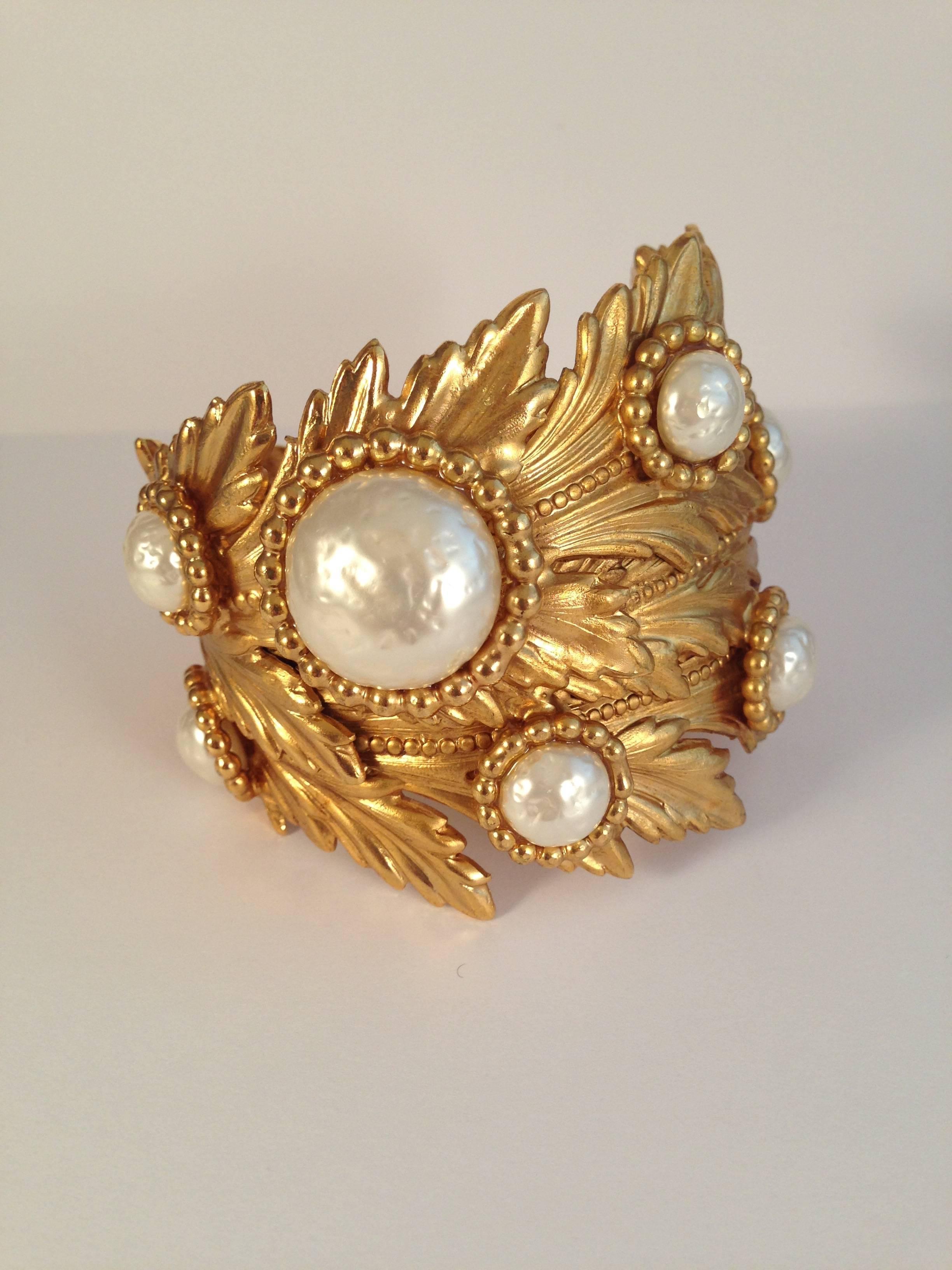 1980s Dominique Aurientis gold-tone leaf cuff bracelet. This bracelet is definitely a statement maker. The 'Dominique Aurientis' signature plaque has fallen off but it is one of her signature pieces. It is made up of faux gold-tone leaves that are