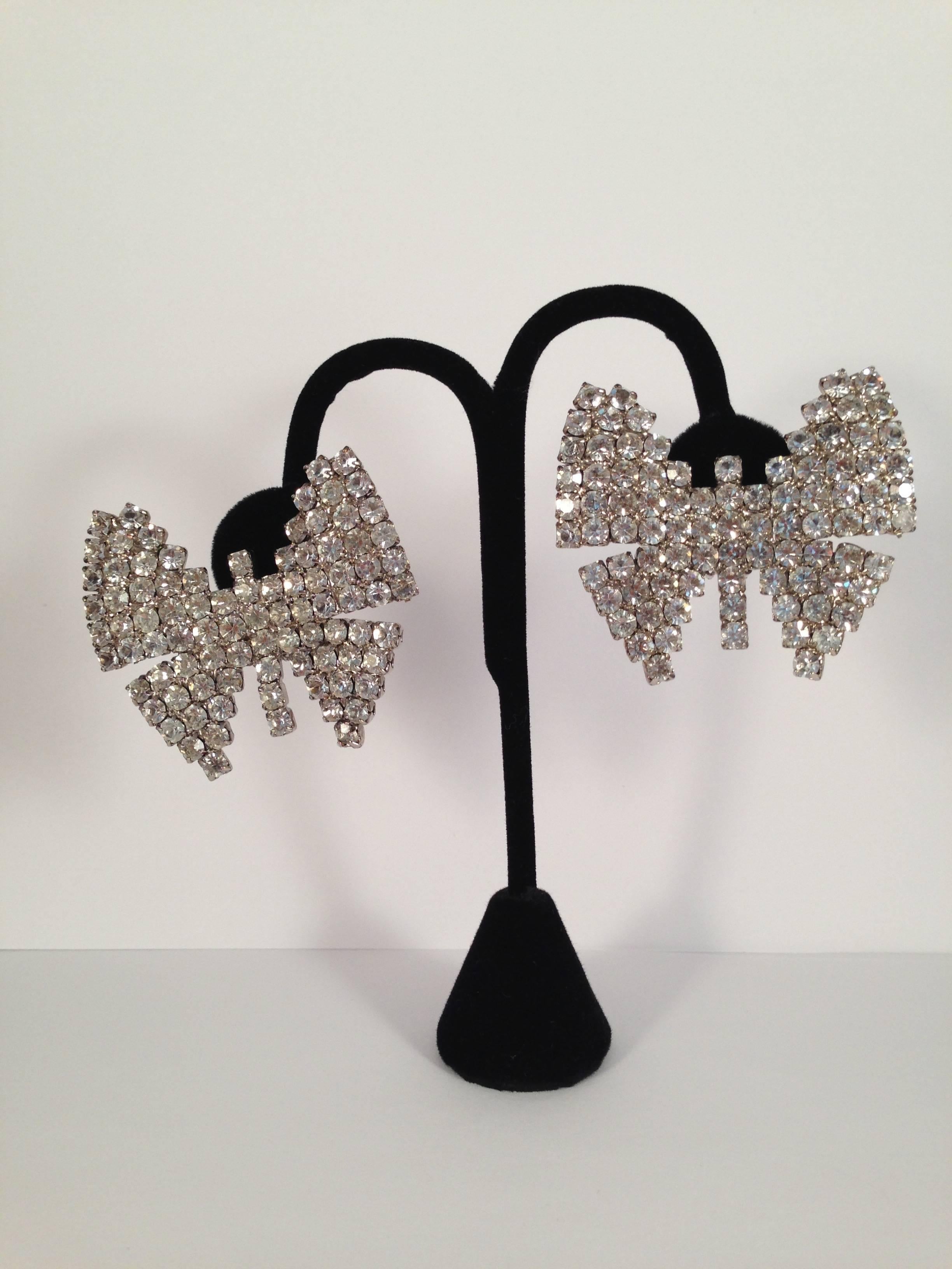 These large rhinestone butterfly clip-on earrings were made by Weiss in the 1960s. They are huge and measure 2 1/4" wide by 1 7/8" high. They are marked 'Weiss' on the back of the clips (see photo #5). They are in excellent condition.