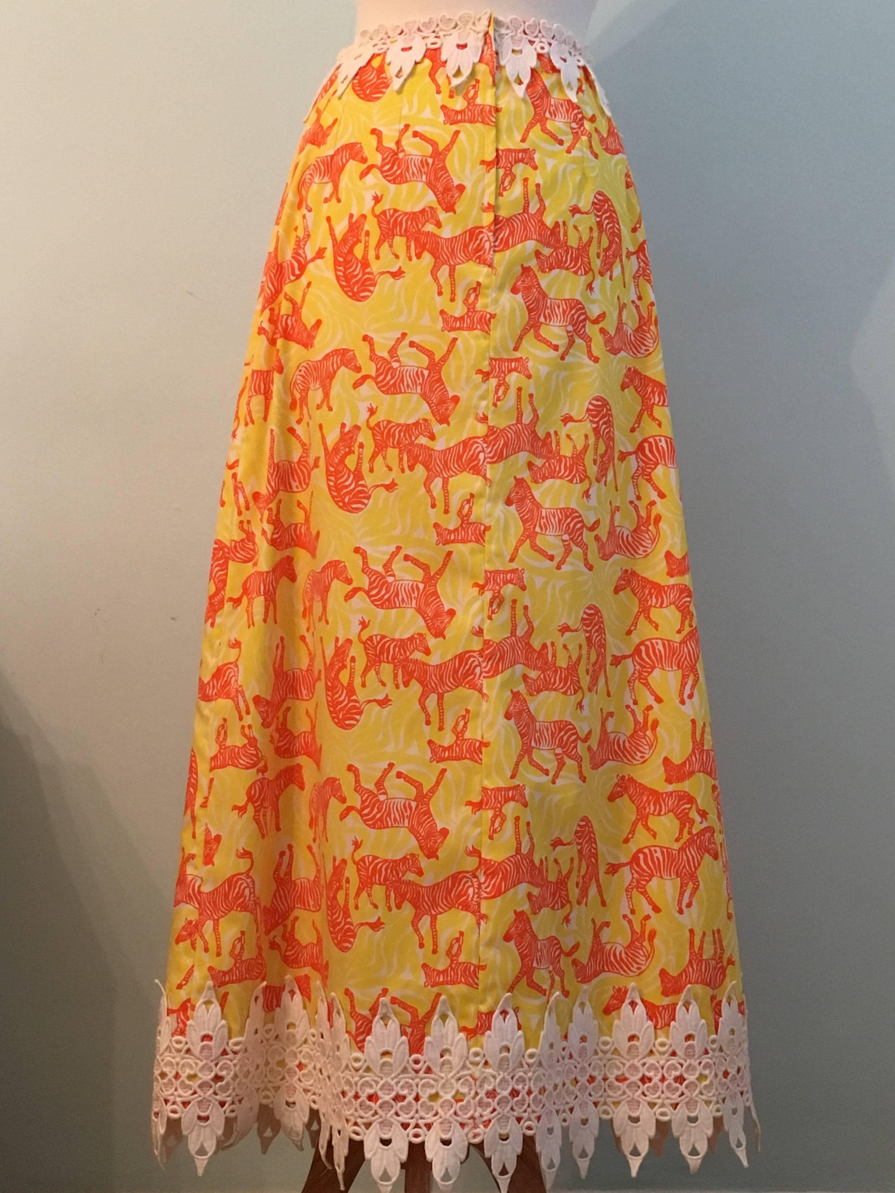 This is a Lilly Pulitzer skirt from the 1970s with an amazing whimsical zebra print pattern. The background of the print features a yellow zebra print which is then overlaid with orange zebras. So fun and so 70s. The skirt has an a-line shape and