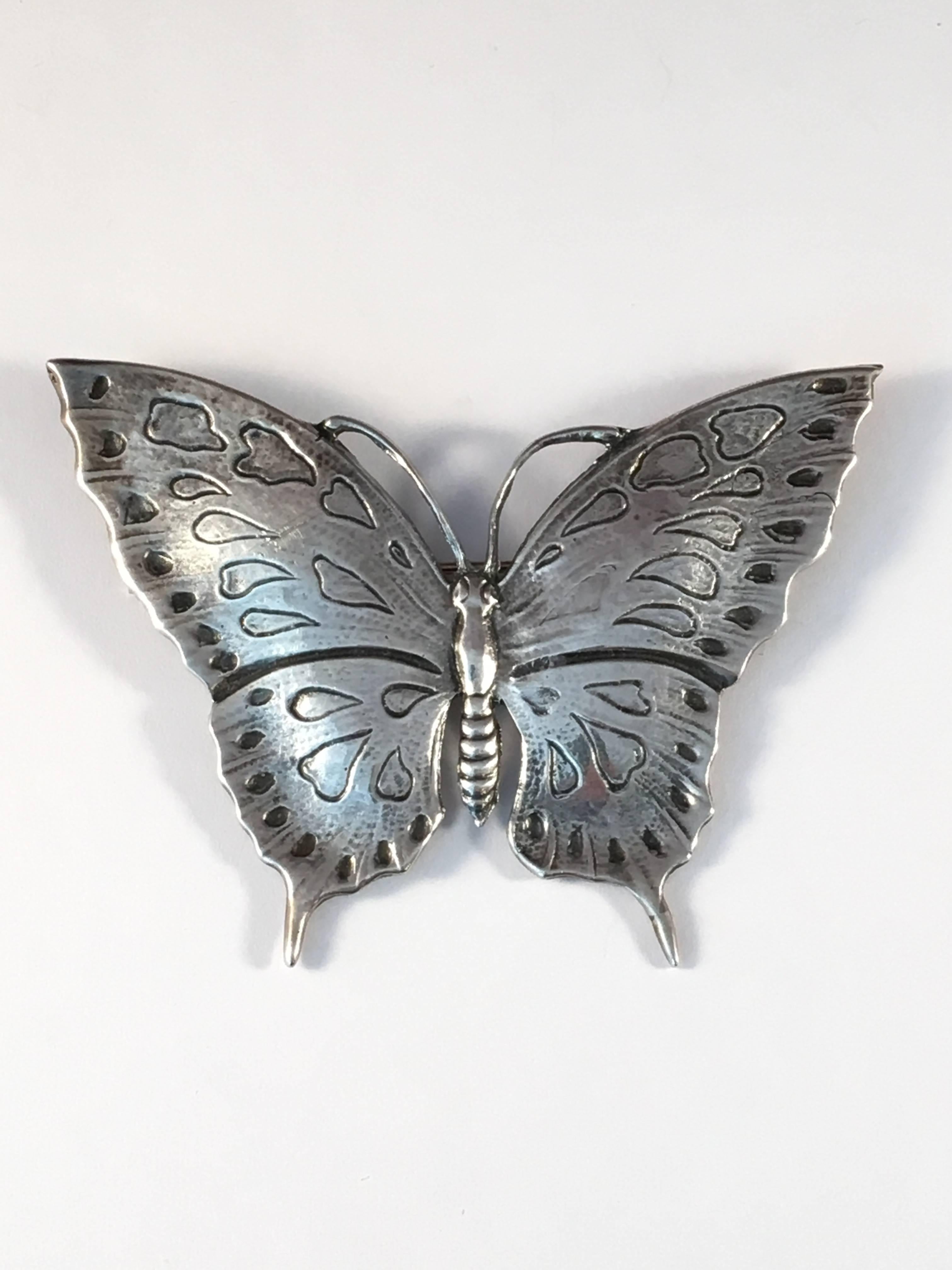 This is a large sterling butterfly brooch by Guglielmo Cini. It measures 3