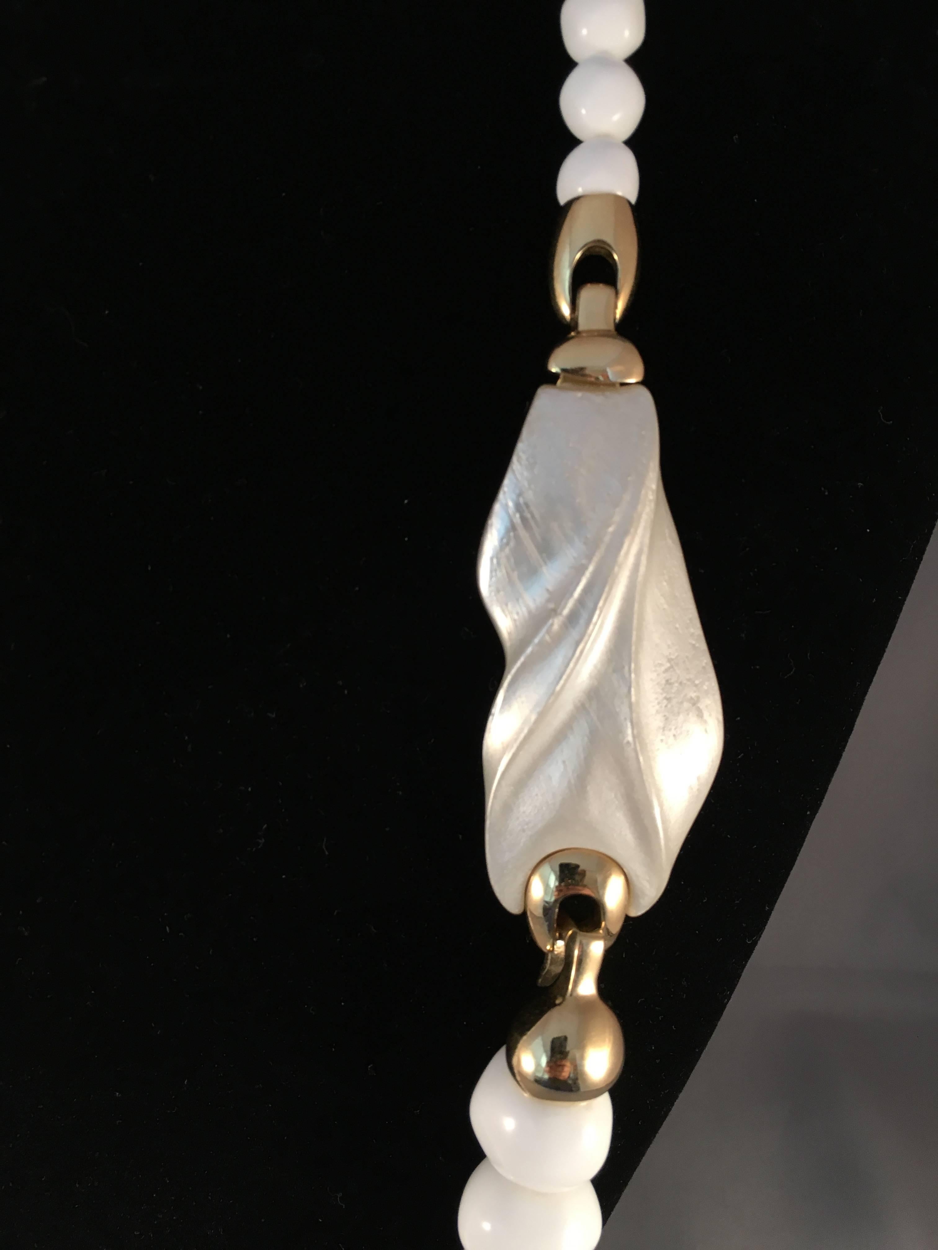 White Modernist necklace designed by Kunio Matusmoto for Trifari. Matsumoto was a Japanese architect who designed jewelry for Trifari in the late 1970s. His pieces have a very sculptural quality to them. The necklace measures 31" long. the