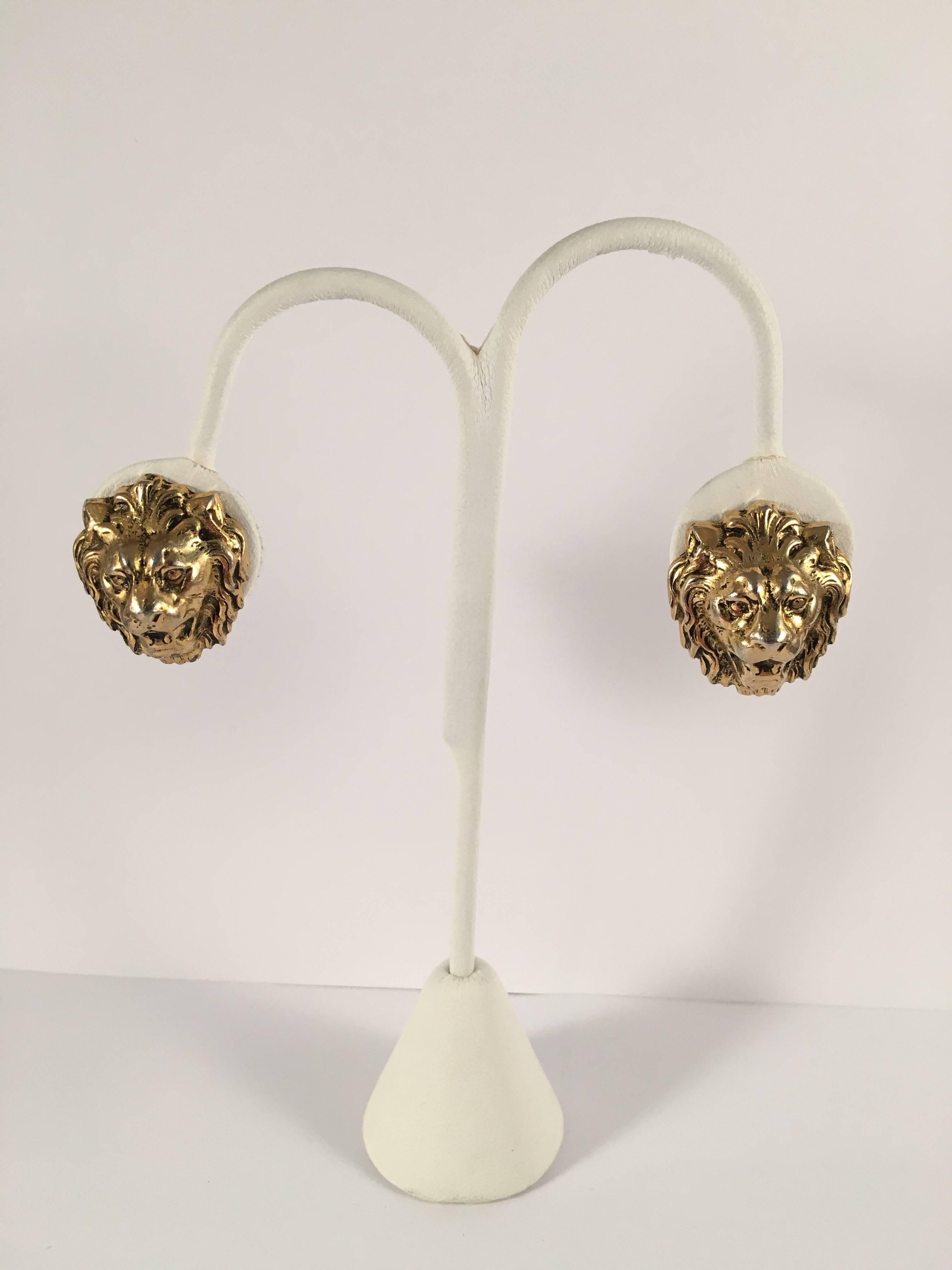 1960s goldtone clip-on lion head earrings from Accessocraft. These earrings are in excellent condition. They are clip-on earrings but they have screw-backs so that the level of tightness can be adjusted. They are marked 'Accessocraft NYC' on the