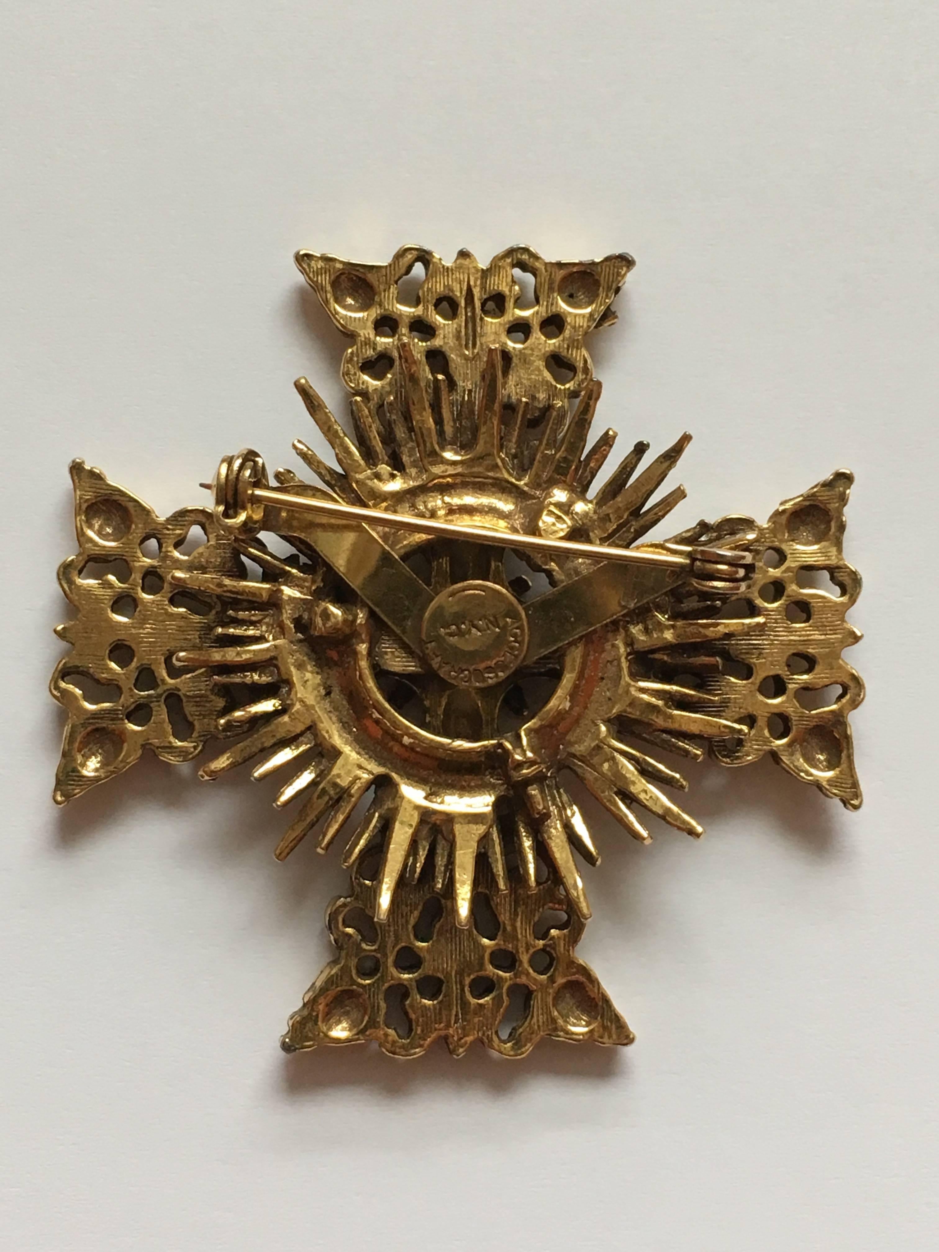 This is a 1960s Accessocraft gold-tone maltese cross brooch. It is in excellent condition and signed, 'Accessocraft N.Y.C.' on the back. 