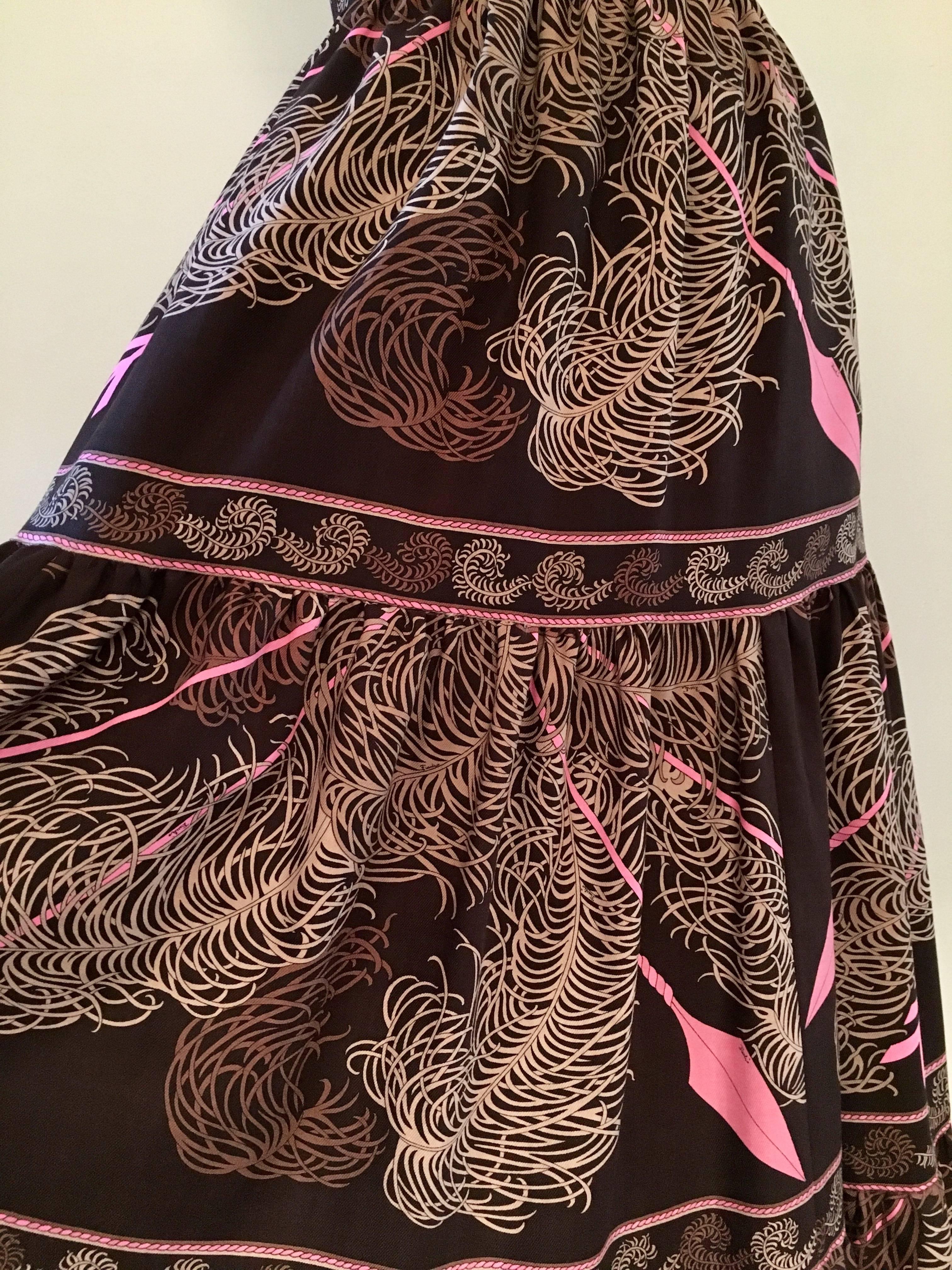 This is a fabulous skirt made in 1977 by Emilio Pucci. It is made out of Pucci's 'Struzzo' or 'Ostrich' print and features ostrich feathers and arrows. The fabric is a wool challis and the skirt is fully lined and made up of three tiers. It zips at