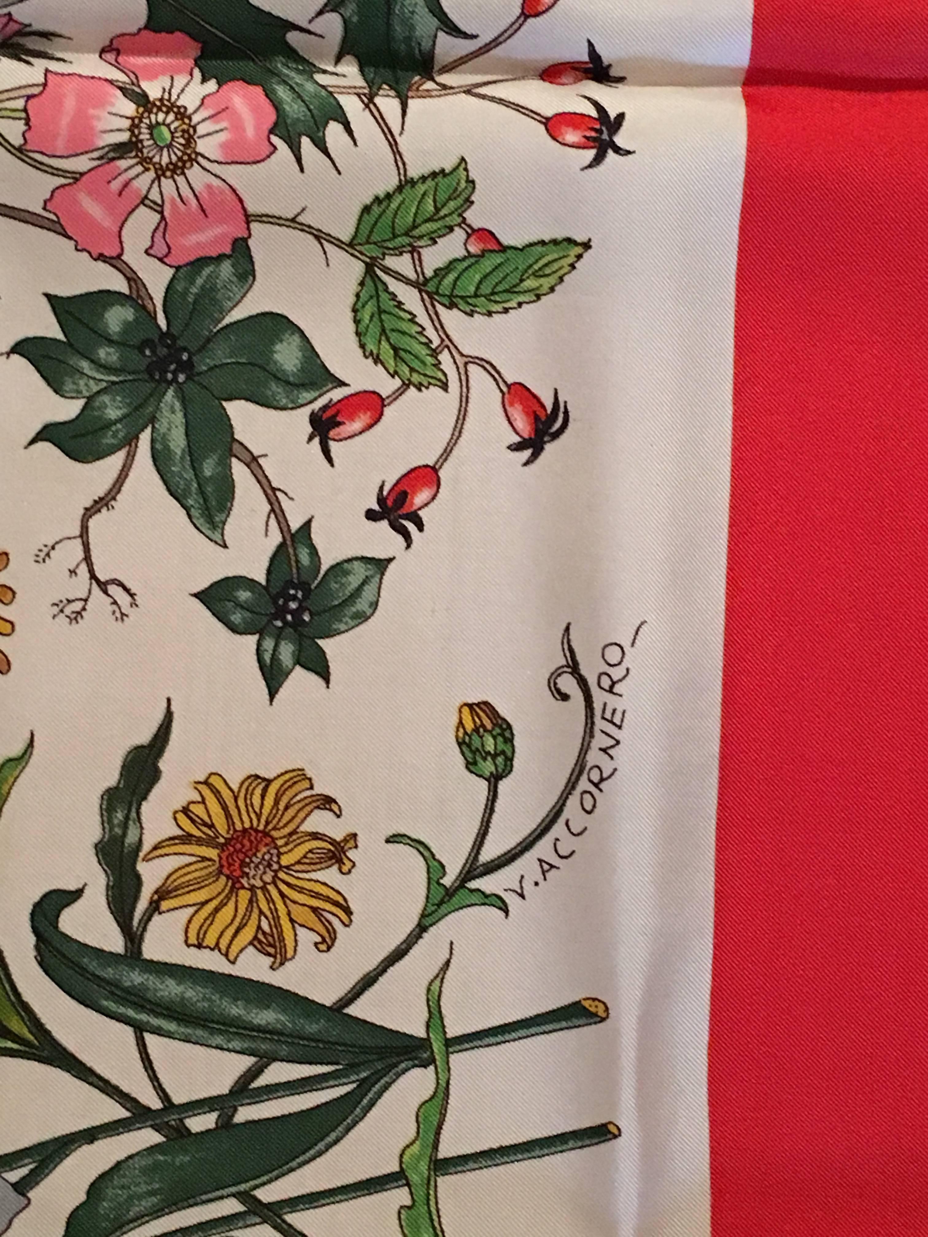This 1980s signature floral print silk scarf from Gucci features the iconic 'Flora' pattern with a red border - perfect for the Holiday season and comes in its original Gucci box. It measures 34
