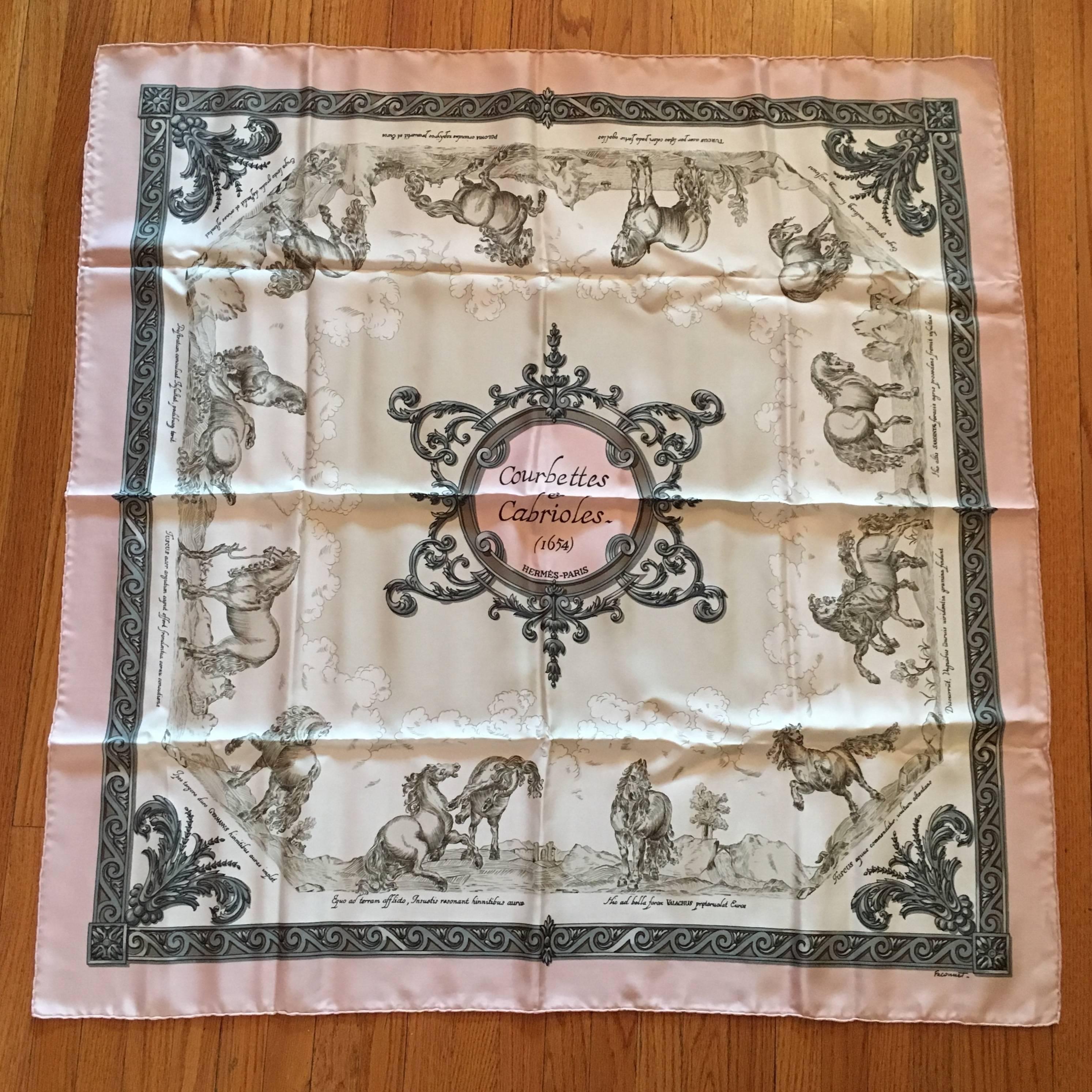 This is a beautiful vintage Courbettes et Cabrioles print Hermes scarf in subtle shades of pink and grey. It is in excellent condition and measures 35