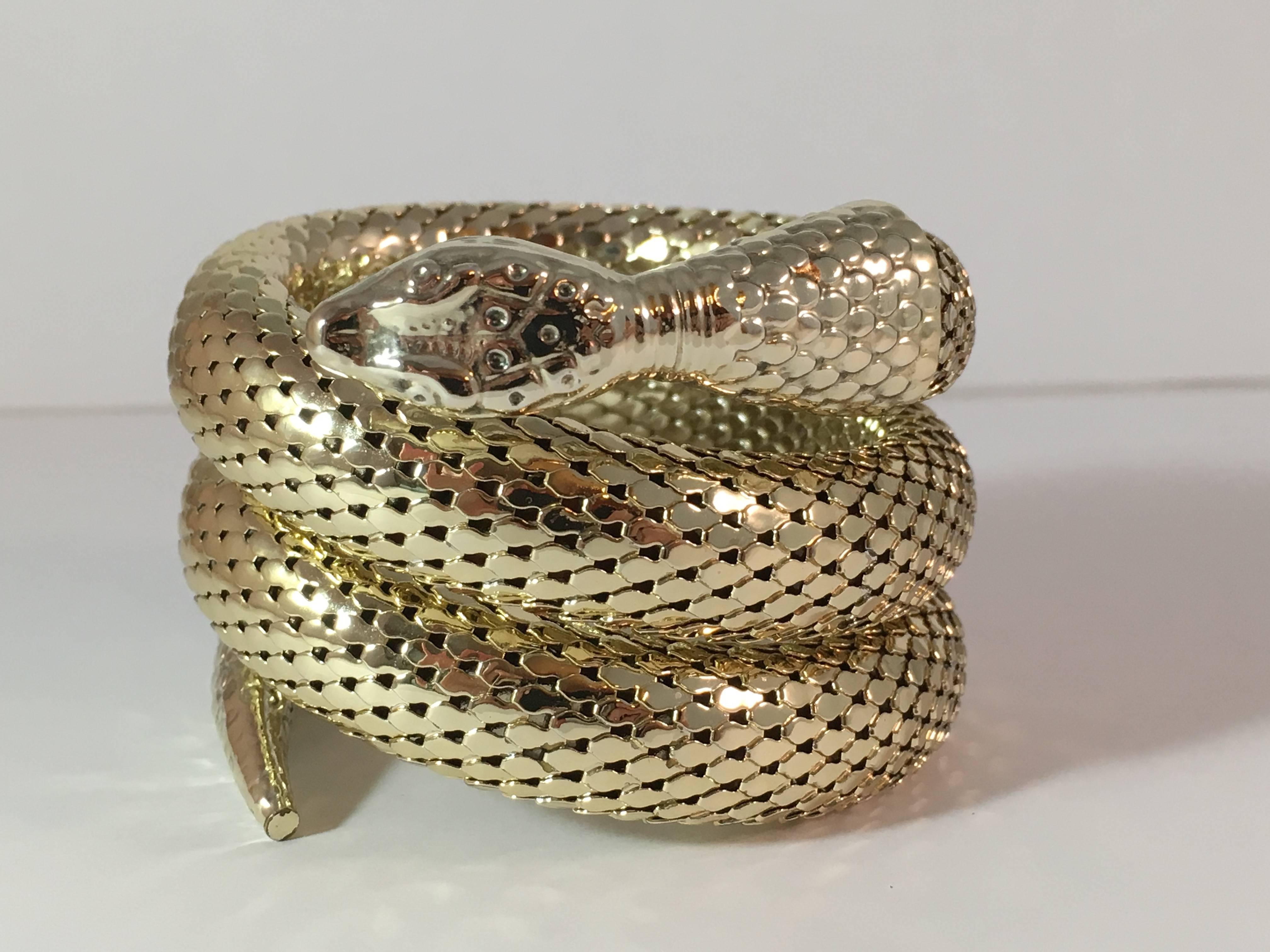This is a 1970s goldtone coiled rattlesnake bracelet from Whiting and Davis - so fabulous! It is made out of Whiting and Davis' signature chainmail mesh. It measures 2