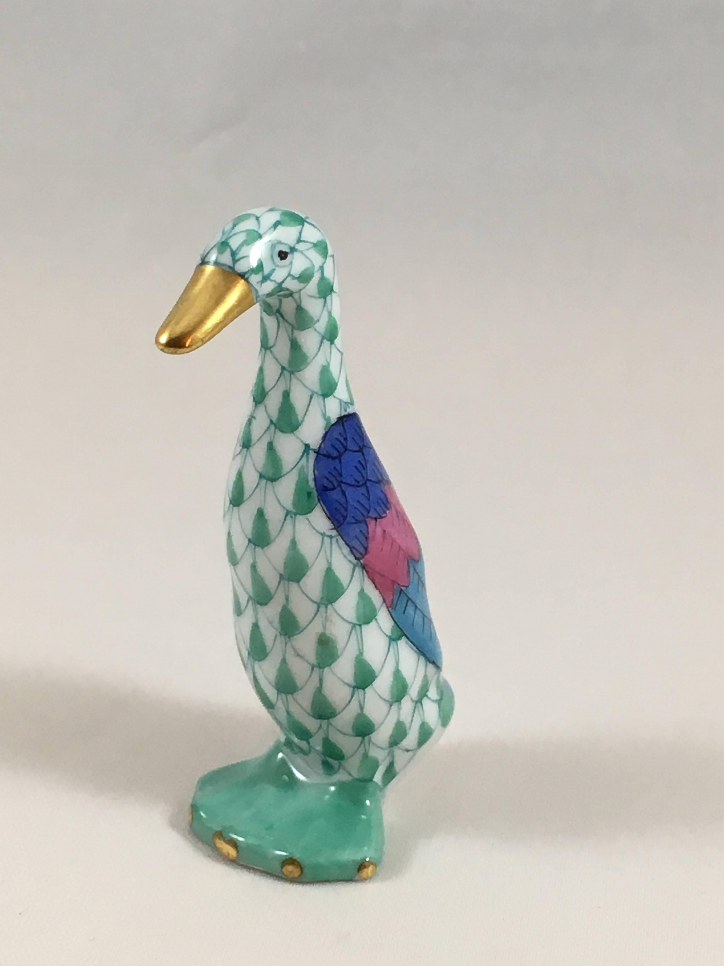 Porcelain Herend of Hungary goose figurine handmade and hand painted in Herend's signature fishnet pattern in green and accented with 24k gold. It measures 2 1/2 inches tall x 1