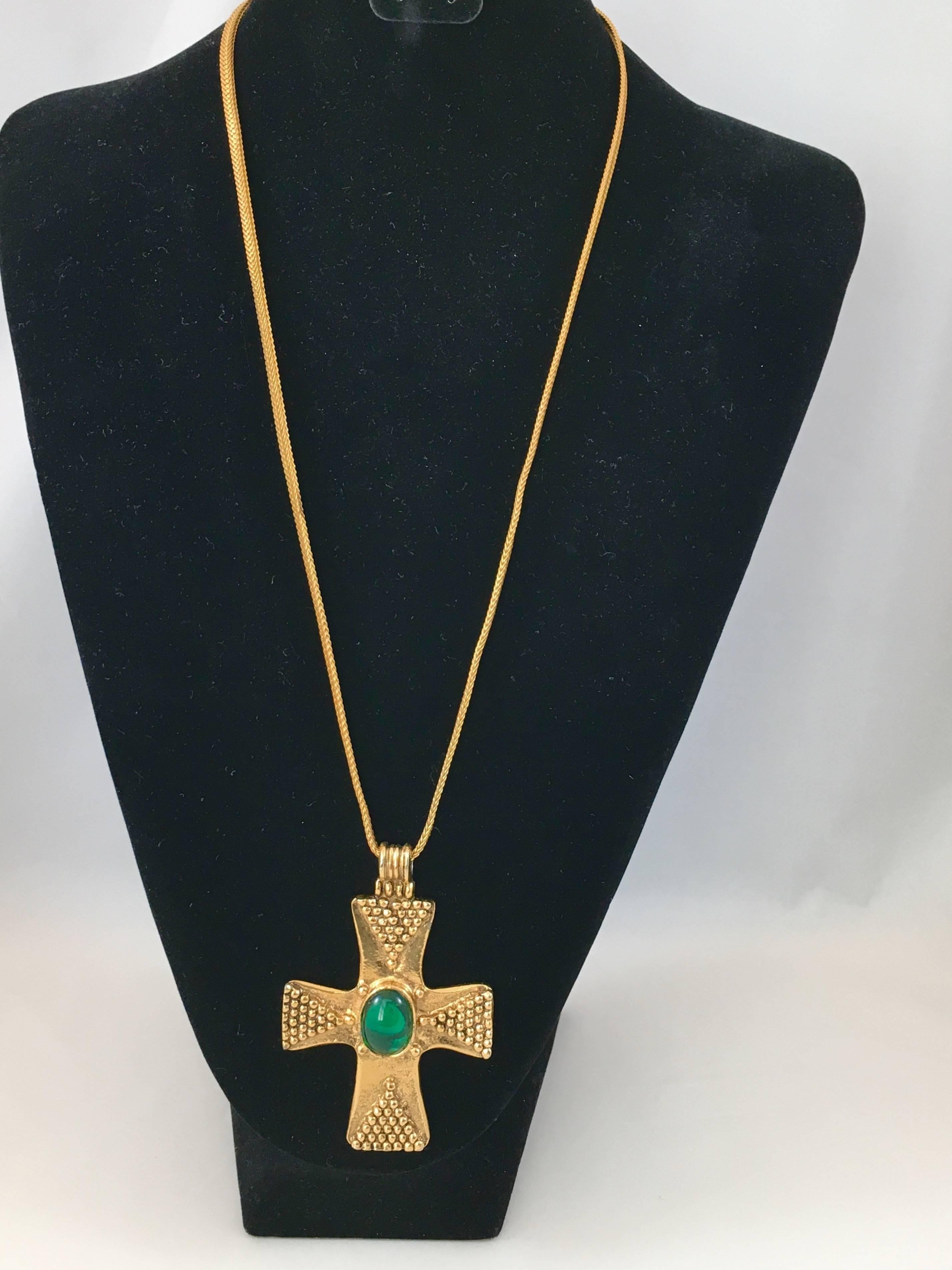 This is a stunning 1970s Yves Saint Laurent cross pendant necklace - so in tune with the Met Show 'Heavenly Bodies'. Overall the necklace measures 16 inches long. This includes the pendant which is 3 1/4 inches long x 2 1/8 inches wide. The cross is