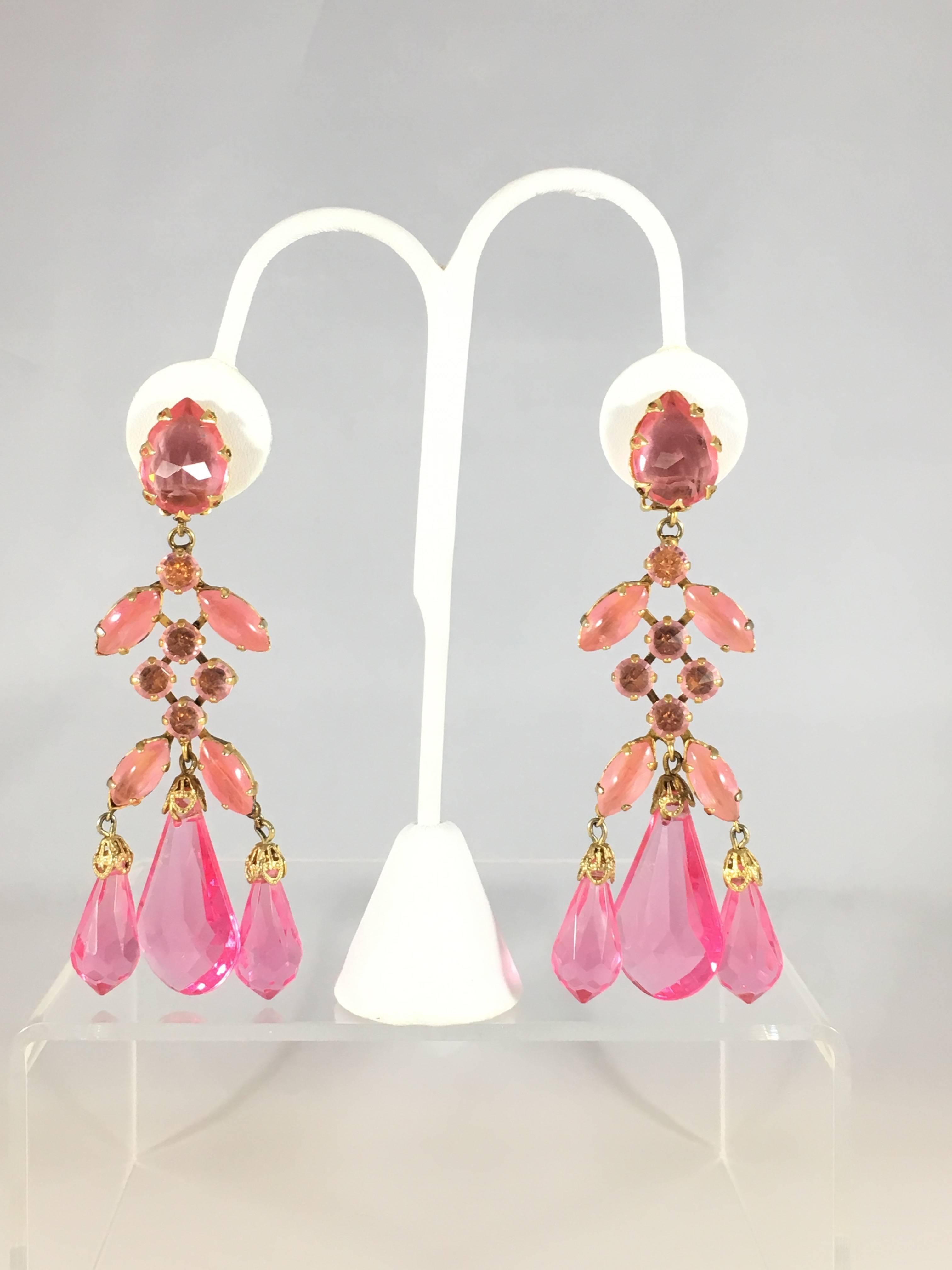 This is an amazing pair of pink show-stopping Schreiner statement chandelier earrings from the 1960s. They are clip-on earrings and they are large - measuring    3 1/4 inches long x 1 3/4 inches wide. The earrings are made out of a gold-toned metal