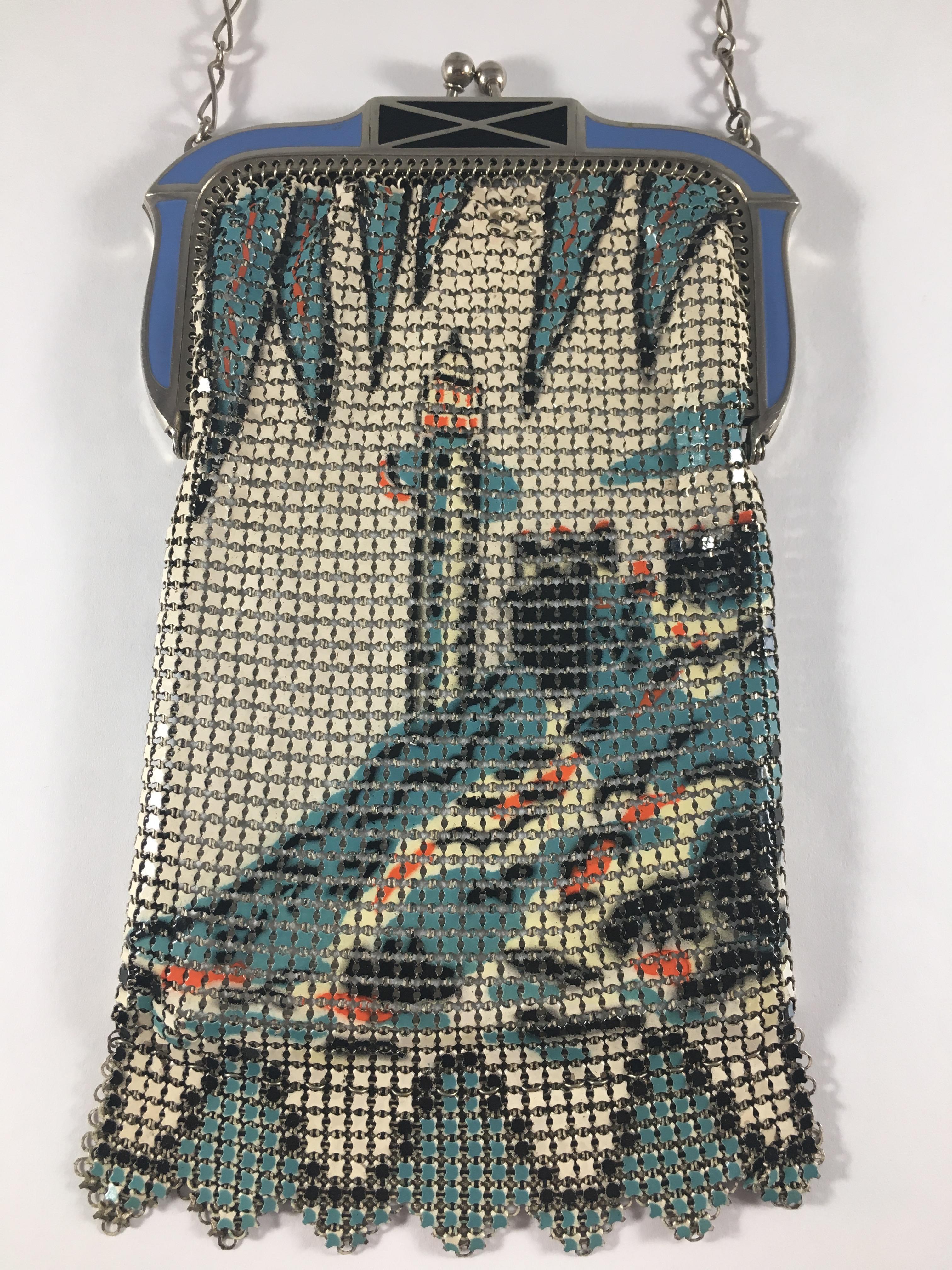 Glamorous and delicate 1920s Whiting and Davis mesh and enamel Lighthouse evening purse. This gorgeous enamel mesh purse features a lighthouse depicted in red, white and blue on both sides of the bag. It has an art deco enameled clasp in blue and