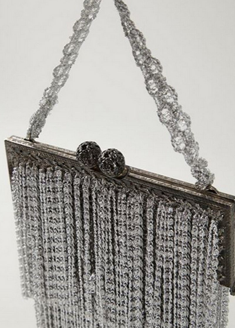Rare 70's Evening Handbag of Loris Azzaro. Made of silver plated metal and Lurex. Very good vintage condition.  Size: 13 x 11 cm, hangle 9 cm.
