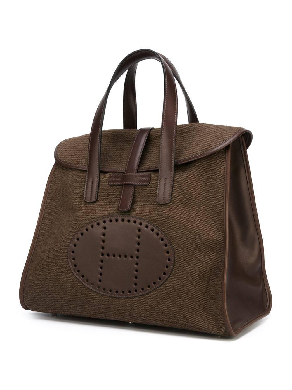 Gorgeous & Rare Hermès Fendou handbag of 2002. Made of brown/kaki canvas and brown leather. Excellent condition. Never used. Hermès Paris Made in France. Letter F in a square. 