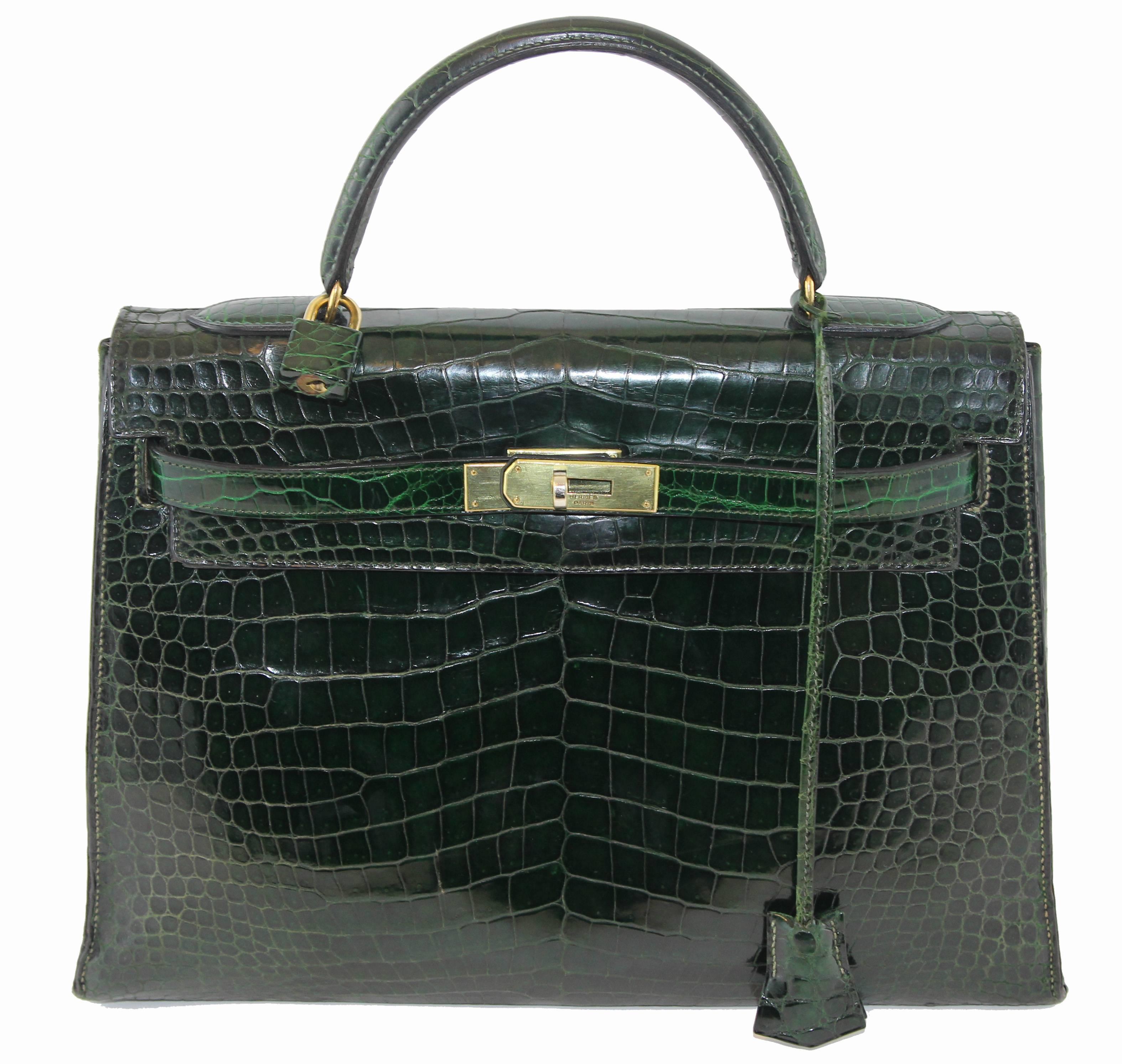 Beautifull and vintage green Hermès Kelly Handbag of the 60s. Some restore and the shoulder strap have been made by an artisan of Hermès. Gold hardware finishing. 
The bag will be sent with certificate and cites. Cites made under the name of the