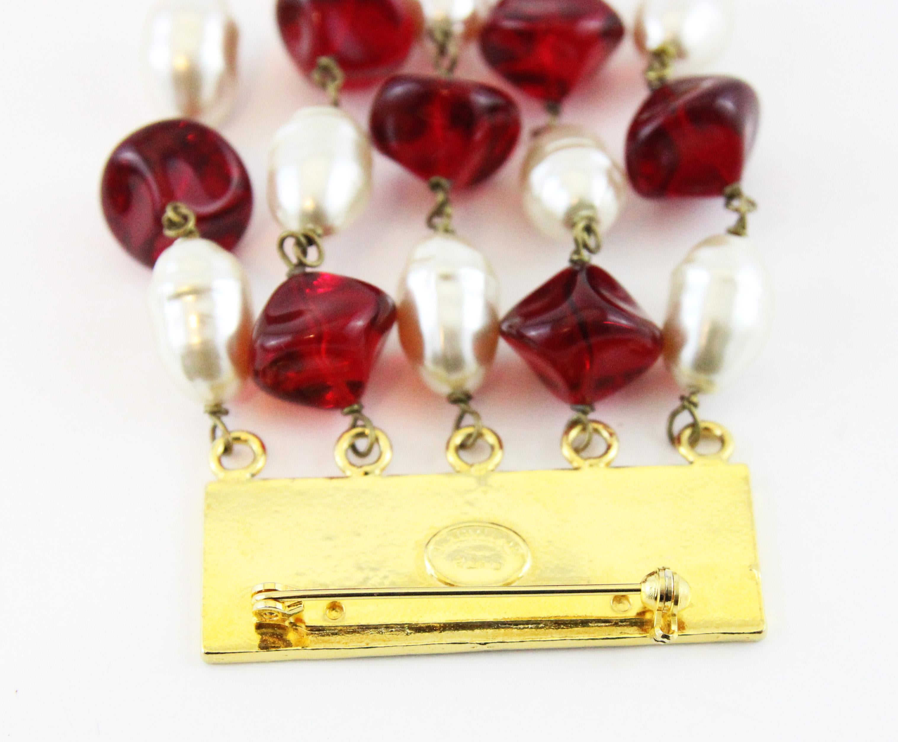 Mint condition and real must-have !!! Fun and beautiful french couture 80s brooch. Gold plated metal, simulated baroque pearls, red resin. Marked Babylone Paris. 
Impressive Size: 12.5 x 6 cm - 5 x 2 1/3 in. 